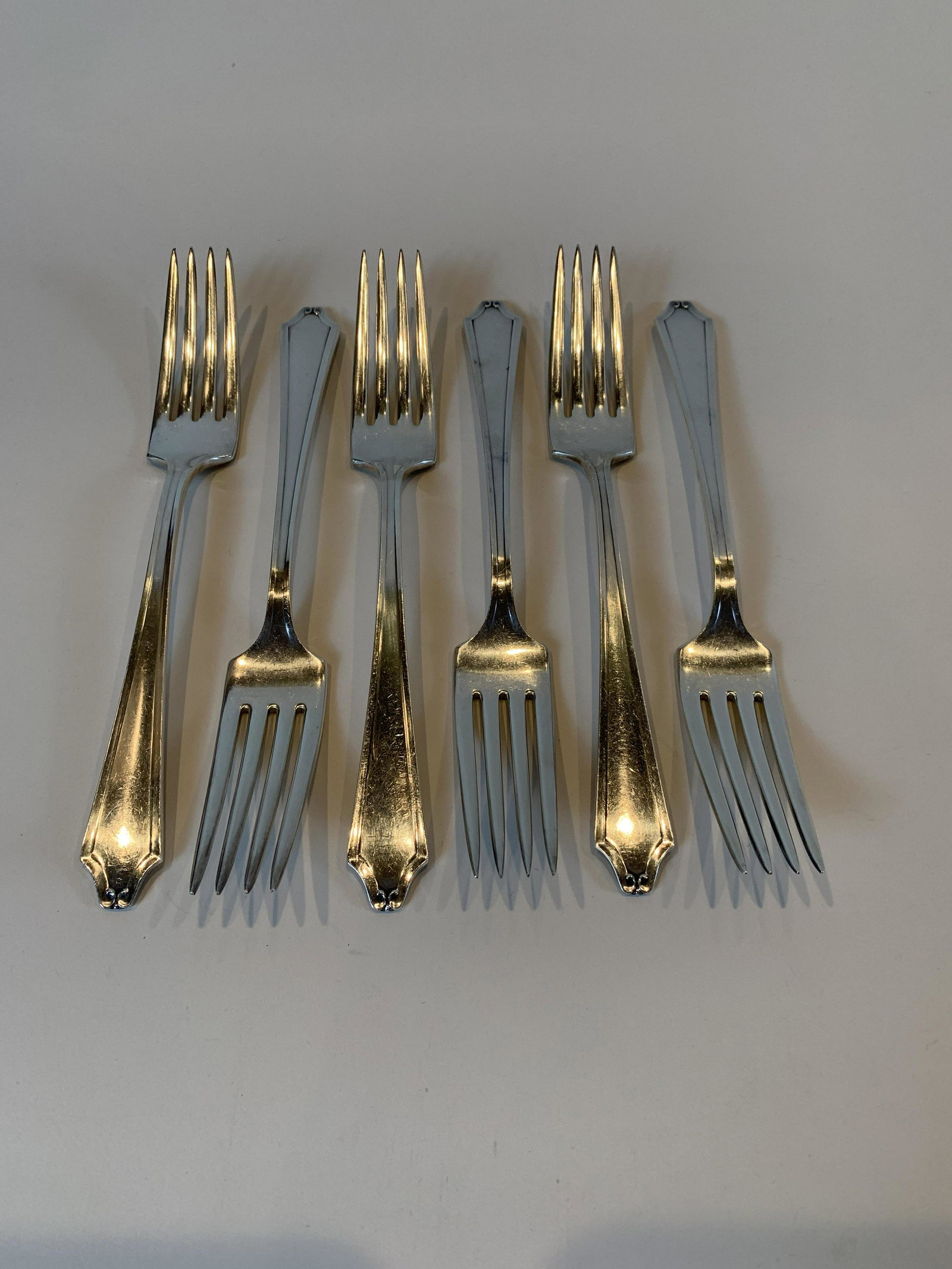 6 International Sterling Minuet Forks: Minuet pattern. 1925. 10 ozt. 7". IMPORTANT: Before bidding, please read the terms and conditions. When you registered for the auction you agreed to these terms and will be required to comply with the