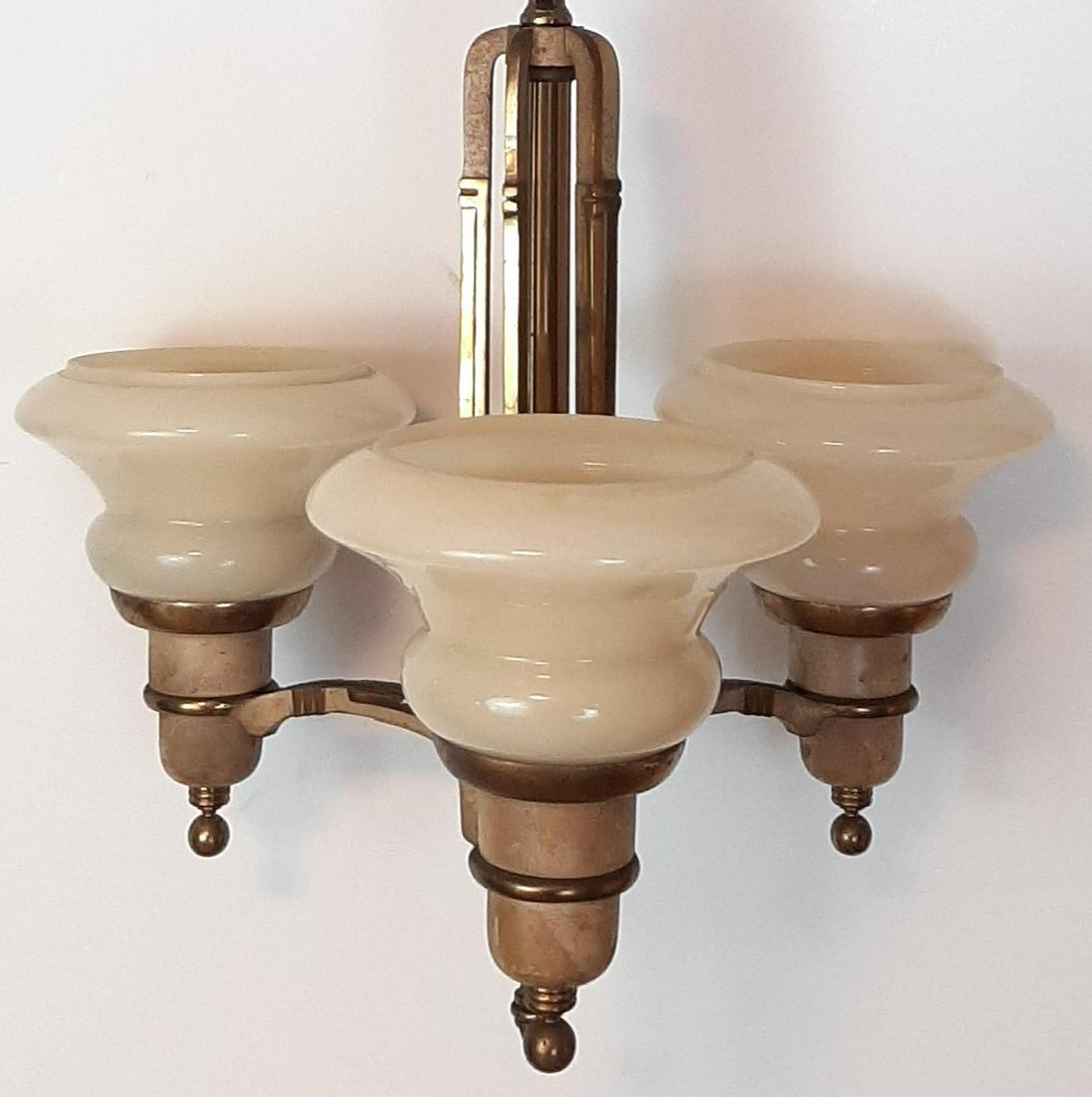 Triple Hanging Light: 1930's. 38" high X 14-1/2" wide. IMPORTANT: Before bidding, please read the terms and conditions. When you registered for the auction you agreed to these terms and will be required to comply with them