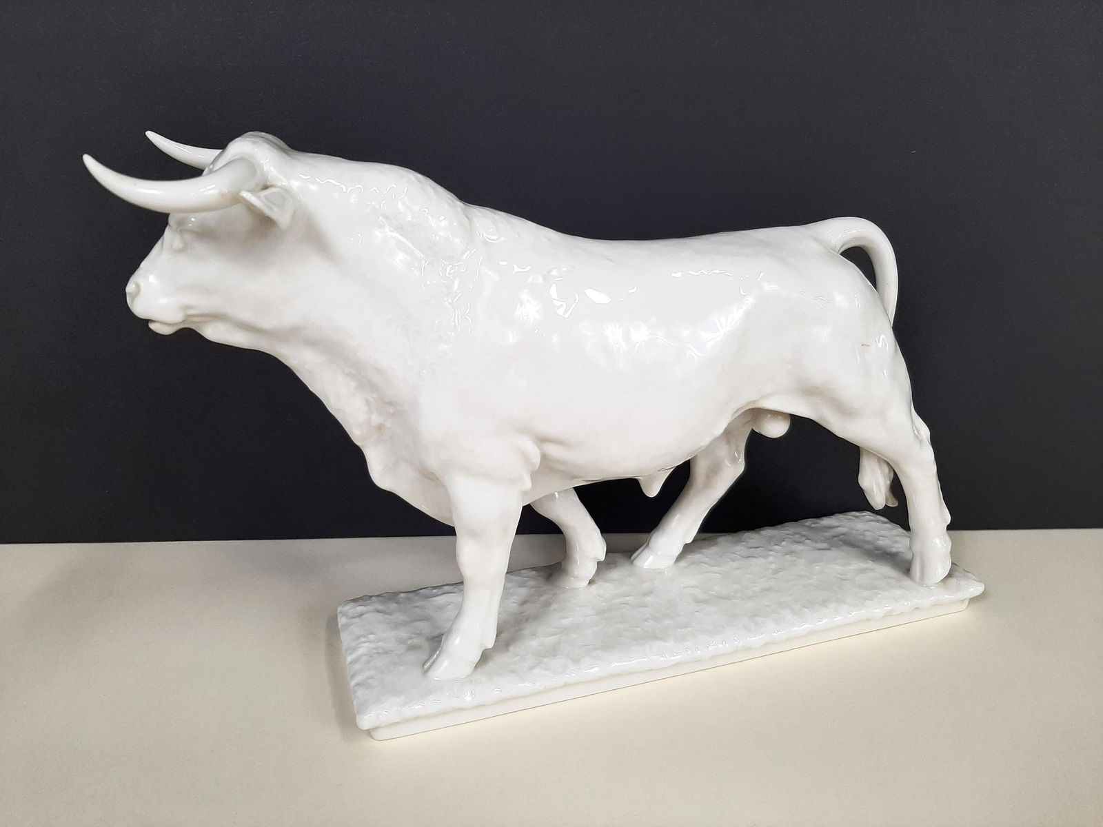Hutchenreuther Bull Figurine: 7" high X 11" long. IMPORTANT: Before bidding, please read the terms and conditions. When you registered for the auction you agreed to these terms and will be required to comply with them.
