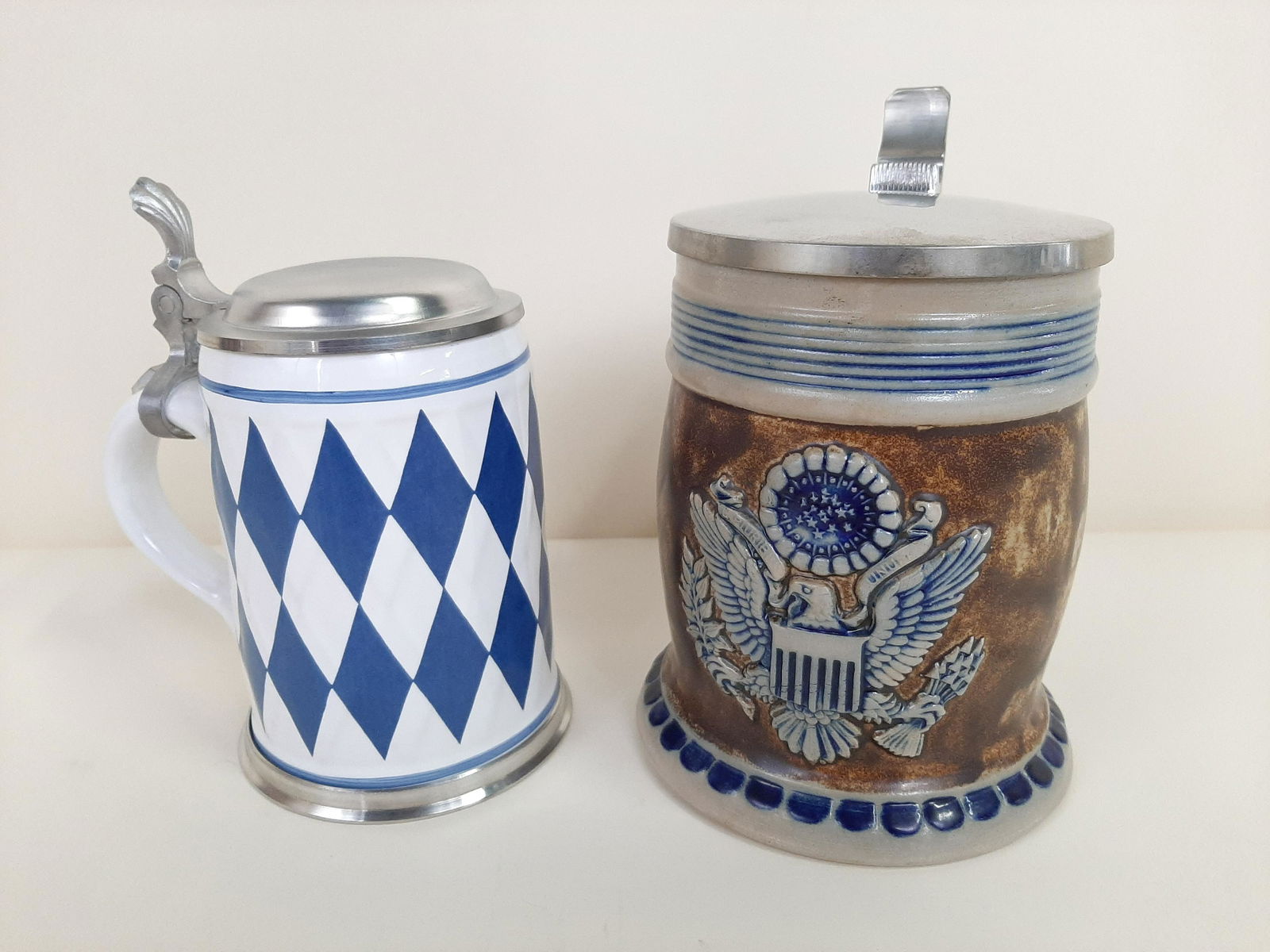2 German Steins incl. Zinn and Goebel: 5-1/2" to 7" wide X 6-1/2" to 7-1/4" high. IMPORTANT: Before bidding, please read the terms and conditions. When you registered for the auction you agreed to these terms and will be required to comply