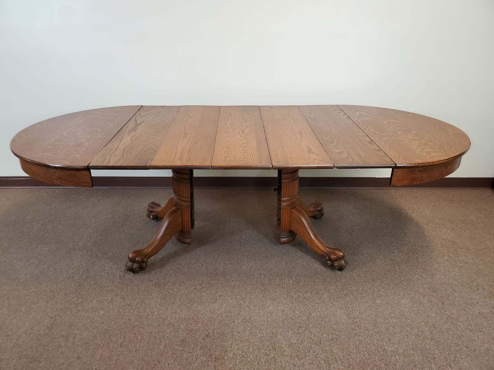 Claw Foot Dining Room Table With 5 Leaves: 42" diameter X 29" high. Leaf 10" wide. Some leaves have loss to clear coat. IMPORTANT: Before bidding, please read the terms and conditions. When you registered for the auction you agreed to these te