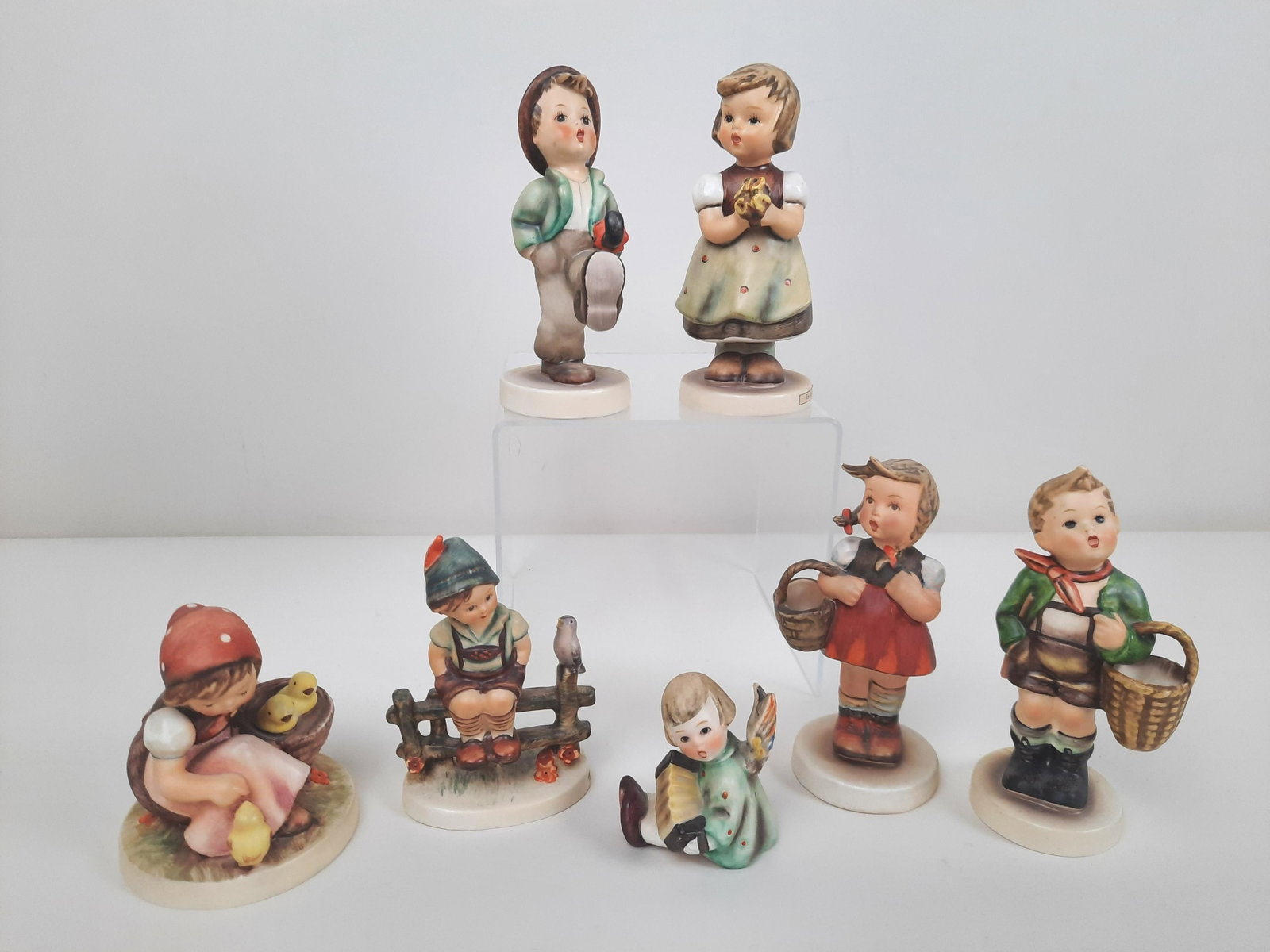 7 Hummel Figurines incl Village Boy: 2-1/4" to 5" high. IMPORTANT: Before bidding, please read the terms and conditions. When you registered for the auction you agreed to these terms and will be required to comply with them.