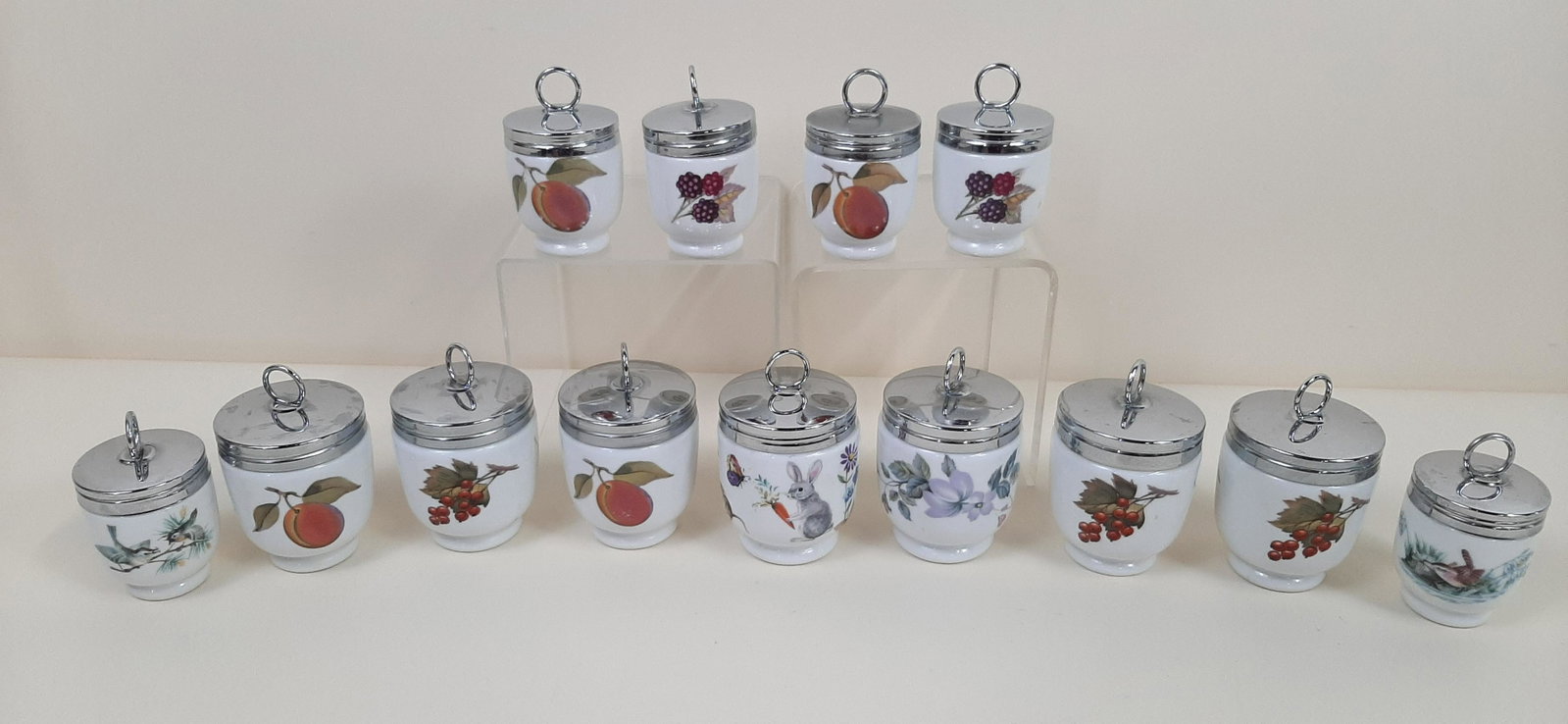 13 Royal Worcester Egg Cups: 2" to 2-1/2" diameter X 3-1/2" to 4" high. IMPORTANT: Before bidding, please read the terms and conditions. When you registered for the auction you agreed to these terms and will be required to comply