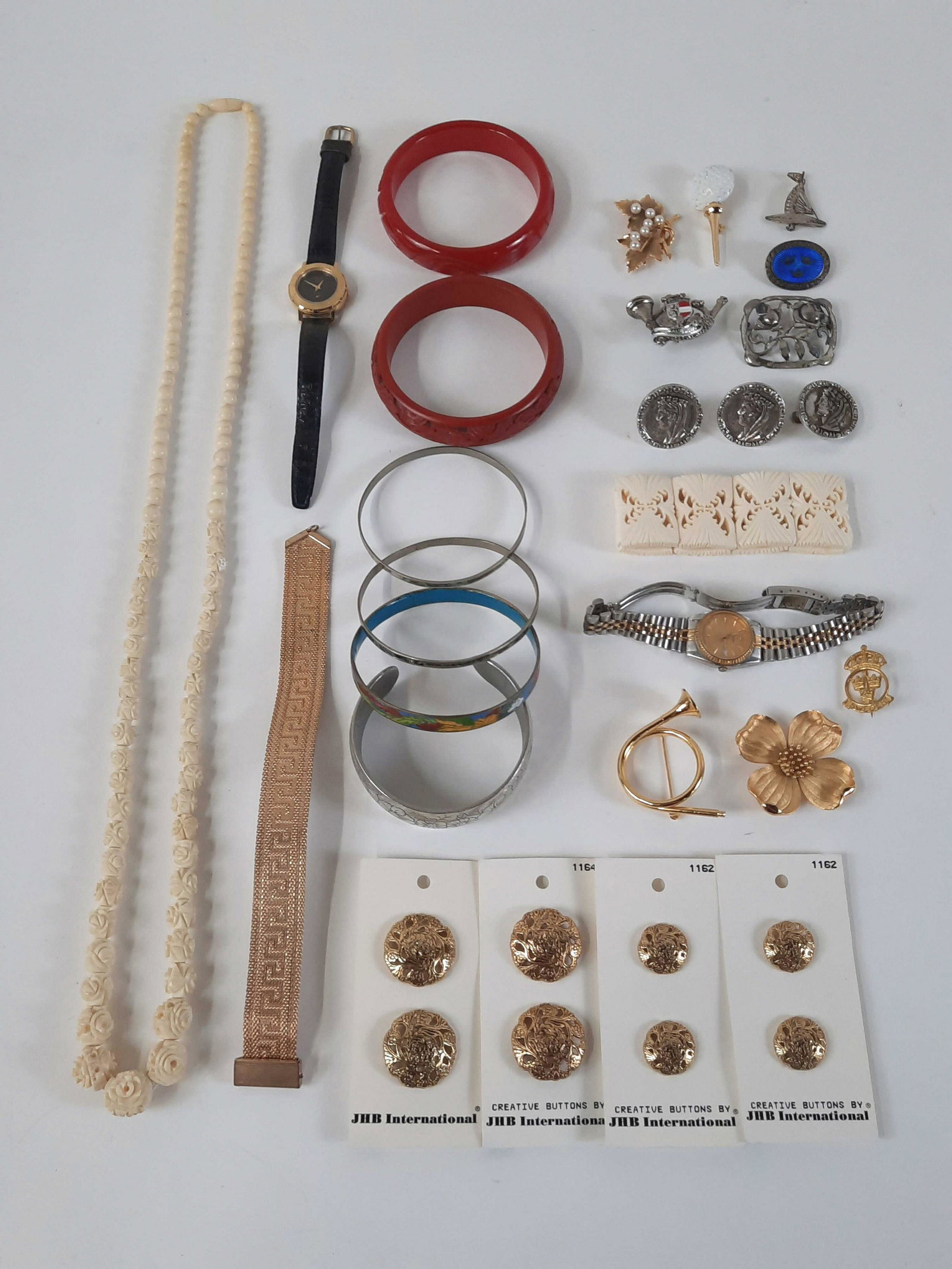 26 Pcs Jewelry incl Wrist Watches: Also includes necklace, bracelets, vintage carved bakelite bracelet, buttons and pins. IMPORTANT: Before bidding, please read the terms and conditions. When you registered for the auction you agreed t