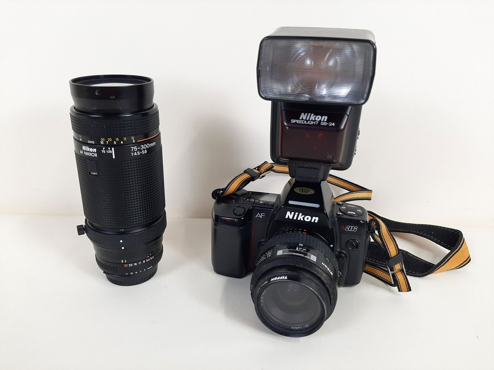 Nikon N8008 Camera: Includes Speedlight SB-24 flash and AF Nikkor 75-300mm lens (UV filter missing). Camera shutter working. With original box. Camera (without flash): 6" wide X 4" high) IMPORTANT: Before bidding, please