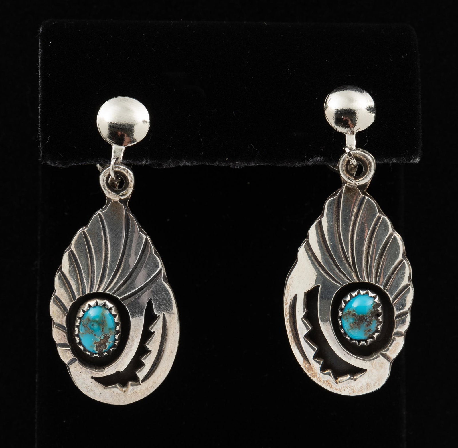 J.W. Begay Silver and Turquoise Earrings: Screw back. 1-3/4" long. IMPORTANT: Before bidding, please read the terms and conditions. When you registered for the auction you agreed to these terms and will be required to comply with them.
