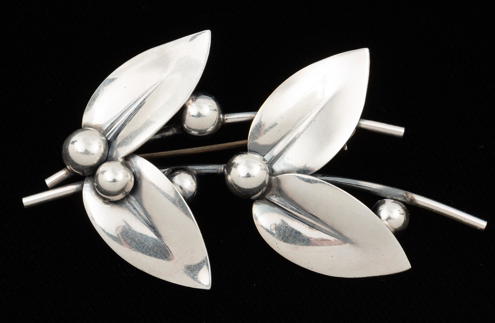 Niels Erik From Danish Sterling Brooch: Signed to back. 2-1/2" wide. IMPORTANT: Before bidding, please read the terms and conditions. When you registered for the auction you agreed to these terms and will be required to comply with them.