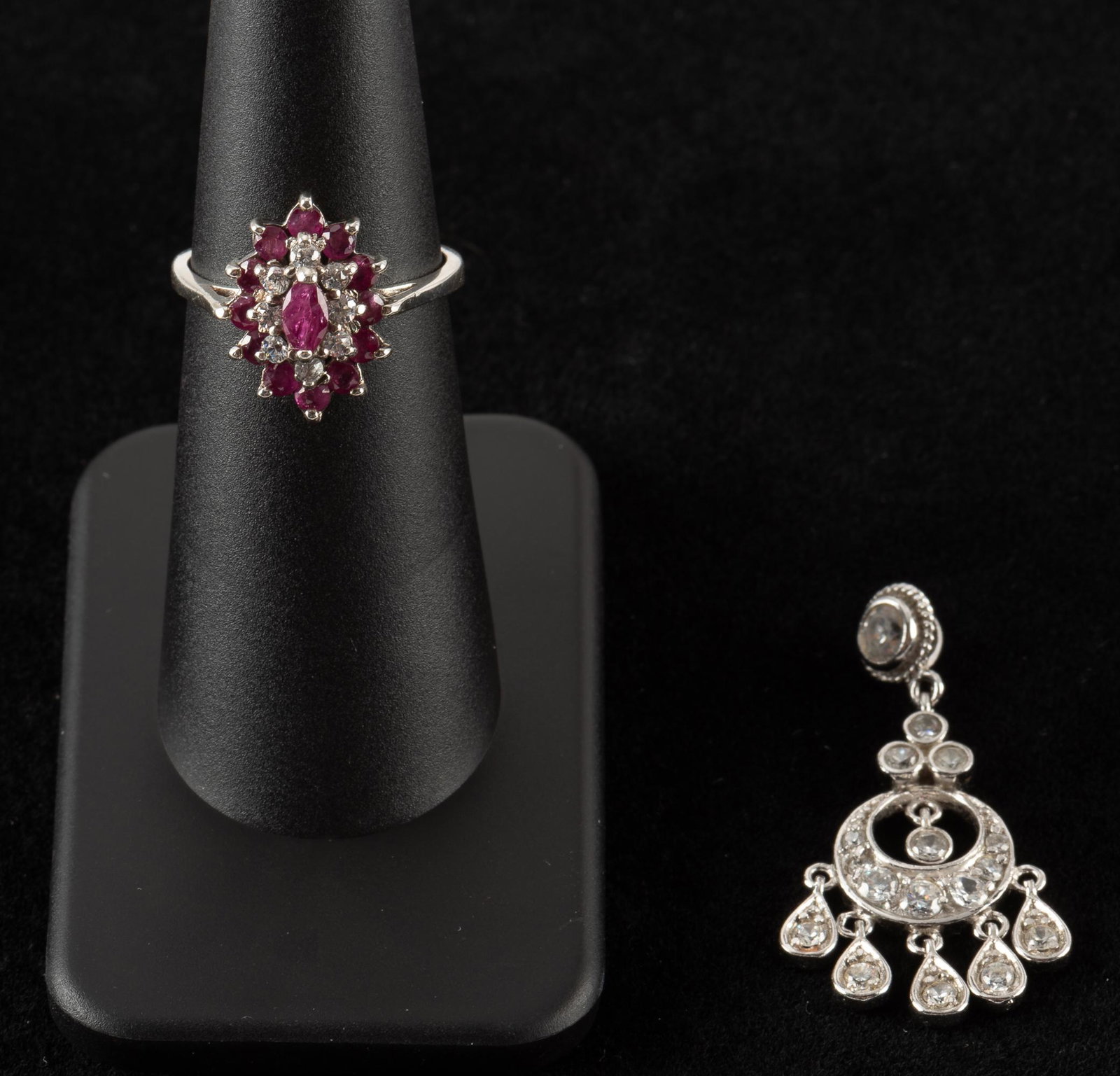Sterling Ring & Pendant: Sterling ring with rubies and white topaz, size 6. Sterling CZ pendant, 1-1/2". IMPORTANT: Before bidding, please read the terms and conditions. When you registered for the auction you agreed to these