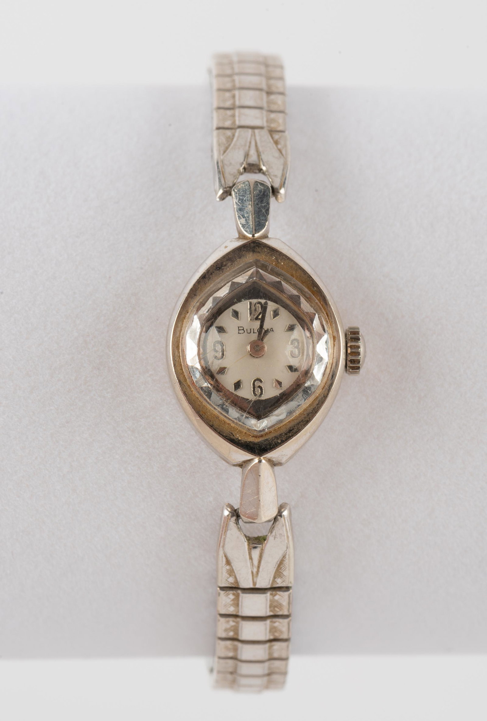 Vintage Ladies Bulova 10K White Gold Wrist Watch: Model M6 case marked M18433.17J movement. Running. 1" lug to lug on elastic band. IMPORTANT: Before bidding, please read the terms and conditions. When you registered for the auction you agreed to the