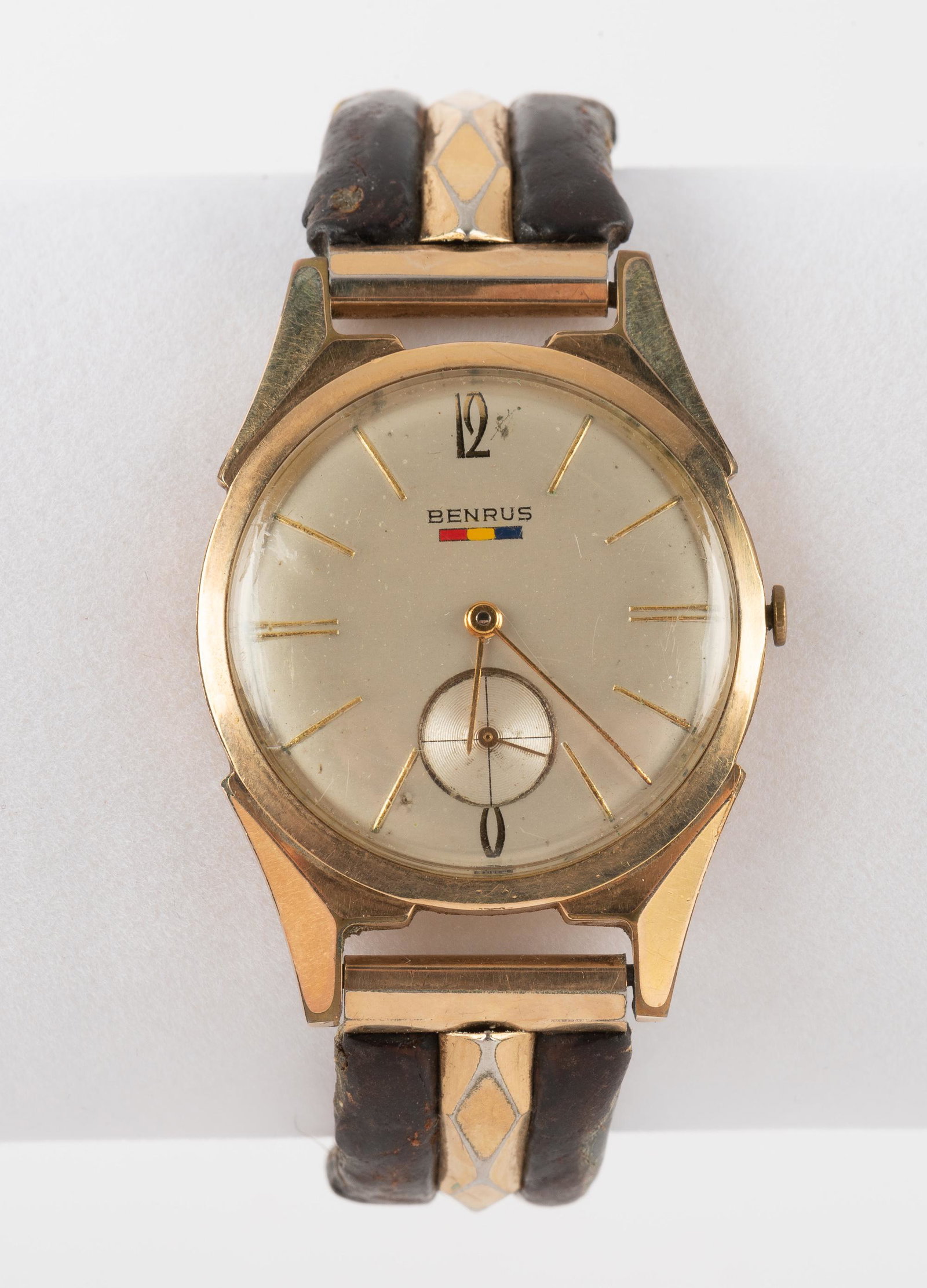 Vintage Benrus Model F120 Wristwatch: 17 J movement with subsidiary second hand. Gold filled case 1-1/2" lug to lug on elastic and leather band. Running. IMPORTANT: Before bidding, please read the terms and conditions. When you registered