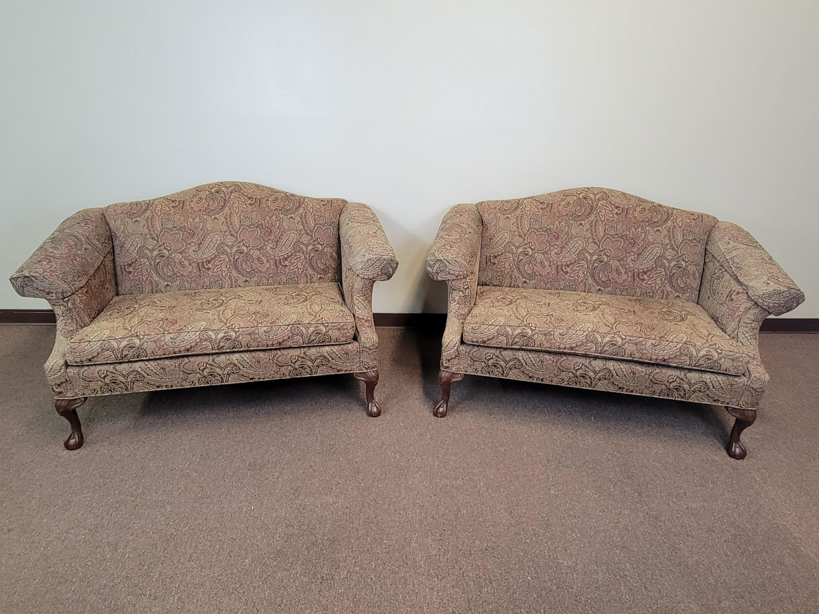 Pair Of Paisley Settees: 59" wide X 32" deep X 35" high. IMPORTANT: Before bidding, please read the terms and conditions. When you registered for the auction you agreed to these terms and will be required to comply with them.