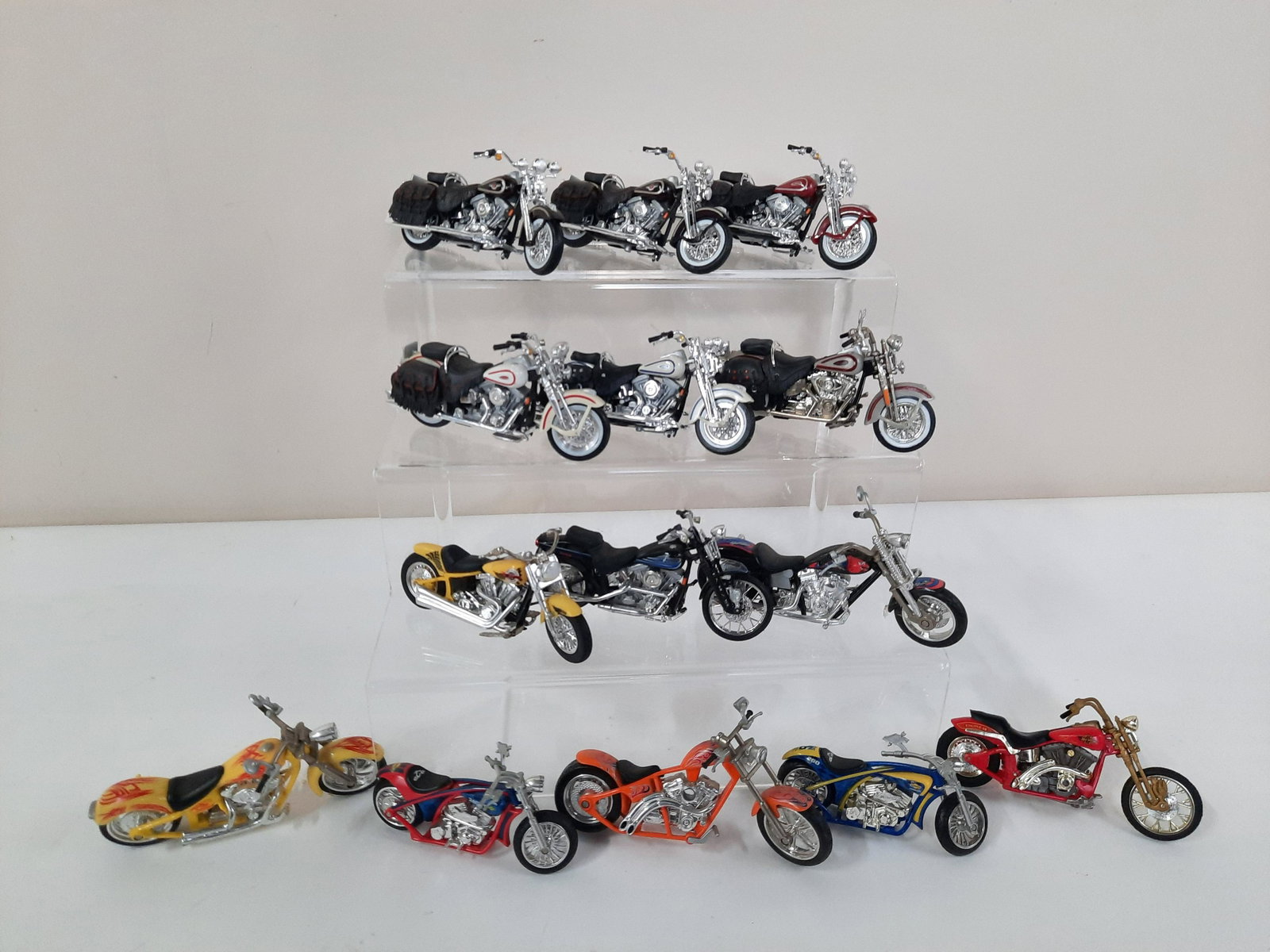 14 Miniature Harley Davidson Motorcycles: 2" to 3" high. IMPORTANT: Before bidding, please read the terms and conditions. When you registered for the auction you agreed to these terms and will be required to comply with them.