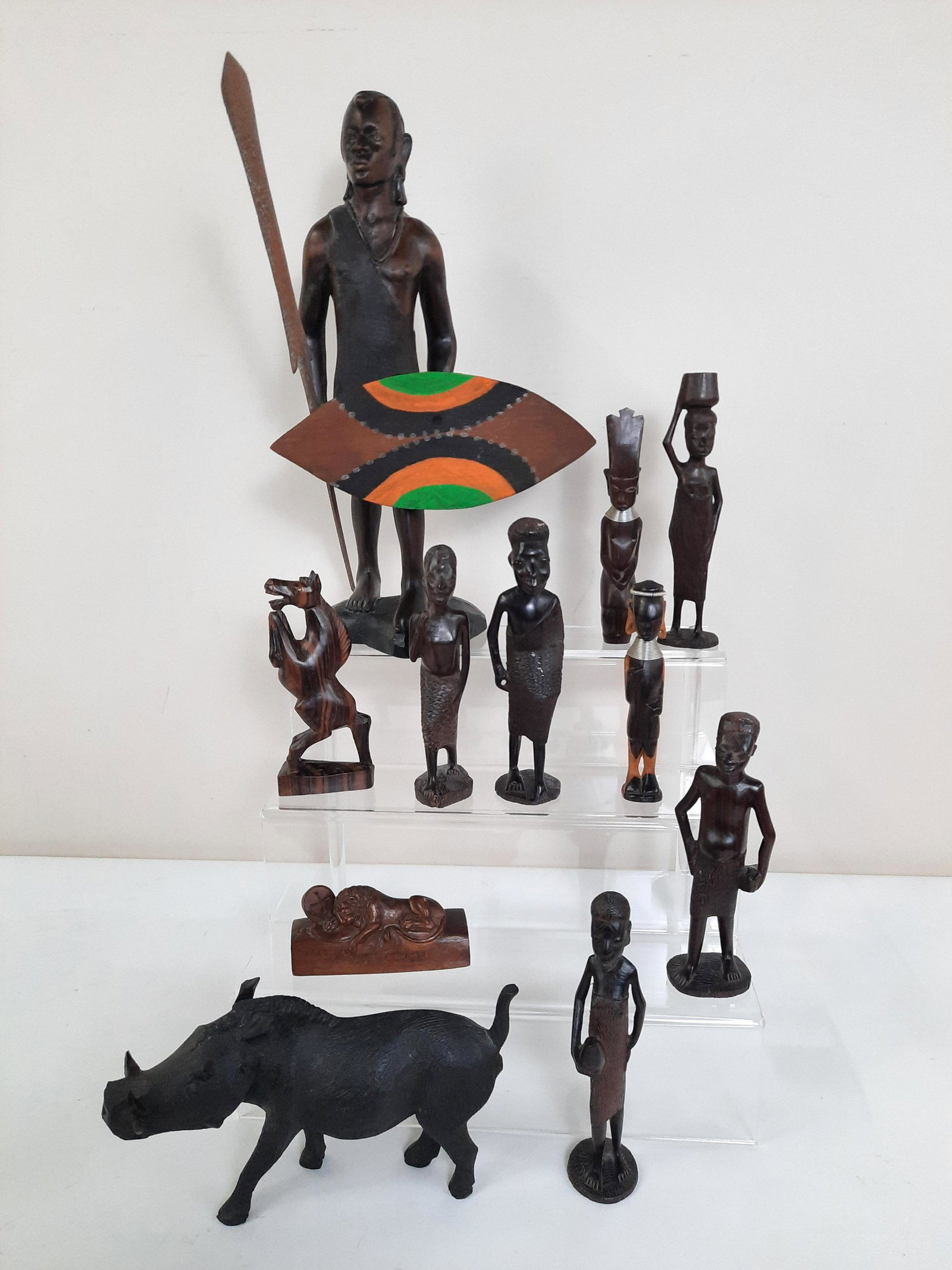 11 African Wood Carved Sculptures: 2" to 14-1/4" high. IMPORTANT: Before bidding, please read the terms and conditions. When you registered for the auction you agreed to these terms and will be required to comply with them.