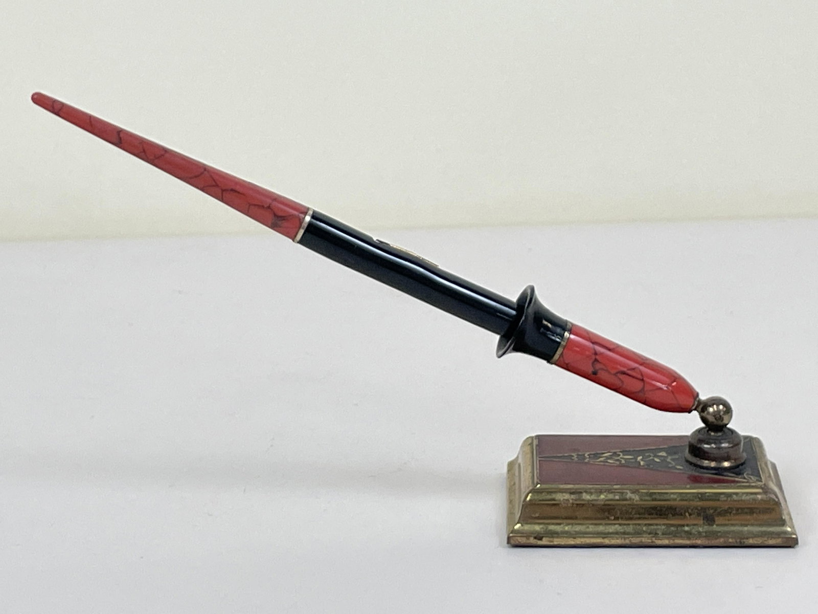 Fountain Pen with 14 K Nib and Holder: 8" wide x 2" deep x 5" high. IMPORTANT: Before bidding, please read the terms and conditions. When you registered for the auction you agreed to these terms and will be required to comply with them.