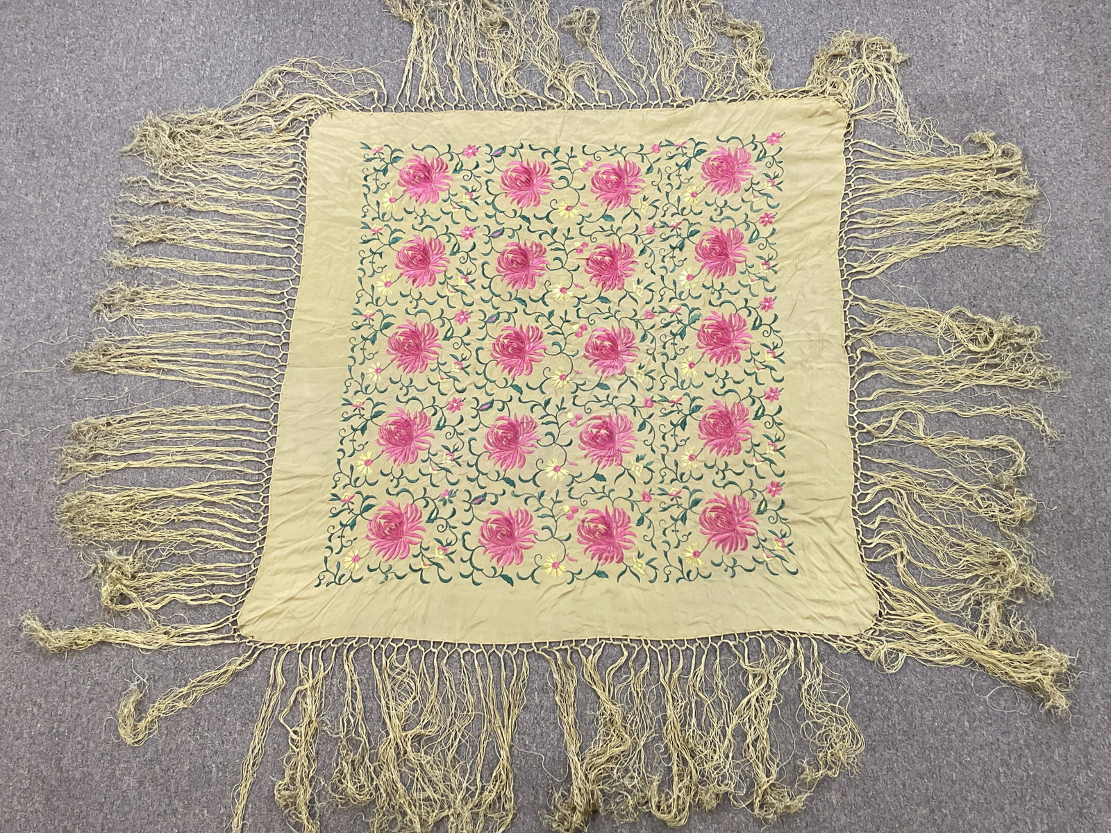 Floral Piano Scarf: 6’ 4 width x 6’ 4 long. Some fringe loss. IMPORTANT: Before bidding, please read the terms and conditions. When you registered for the auction you agreed to these terms and will be required to com