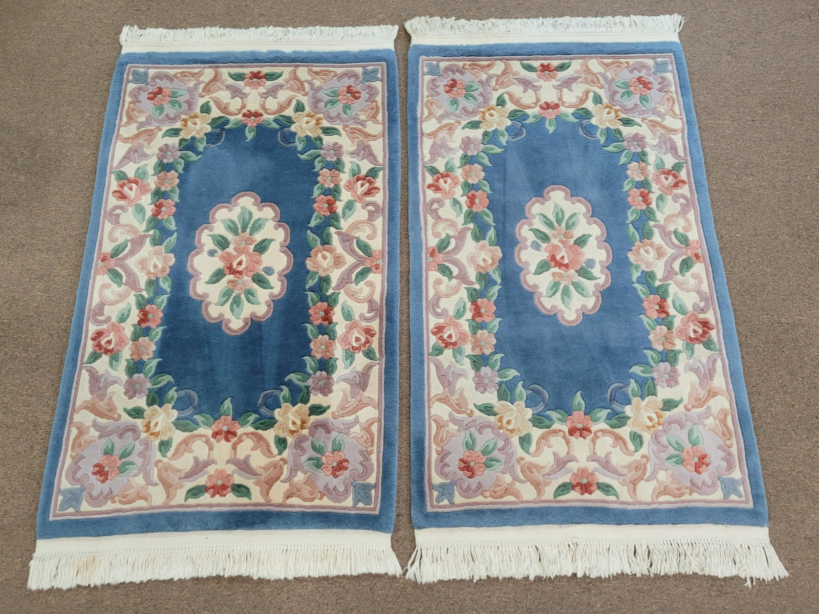 Pair Of Area Rugs: 35" wide X 71" long. IMPORTANT: Before bidding, please read the terms and conditions. When you registered for the auction you agreed to these terms and will be required to comply with them.