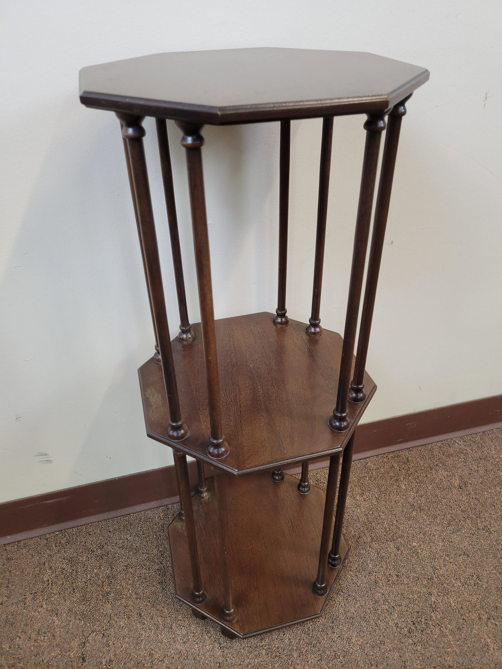 Octagonal Stand: 12" wide X 12" deep ax 36" high. Some finish loss. IMPORTANT: Before bidding, please read the terms and conditions. When you registered for the auction you agreed to these terms and will be required t