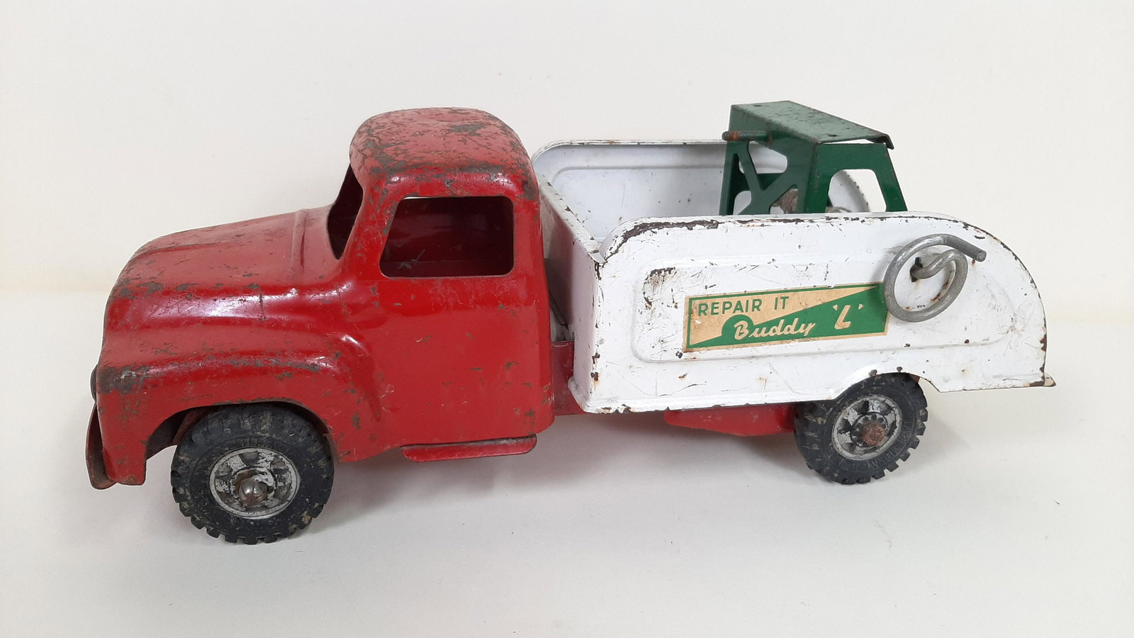 "Buddy L" Die Cast Tow Truck: 6-1/4" wide X 14-1/4" long X 5-1/2 high. Some paint losses and rust. IMPORTANT: Before bidding, please read the terms and conditions. When you registered for the auction you agreed to these terms and 