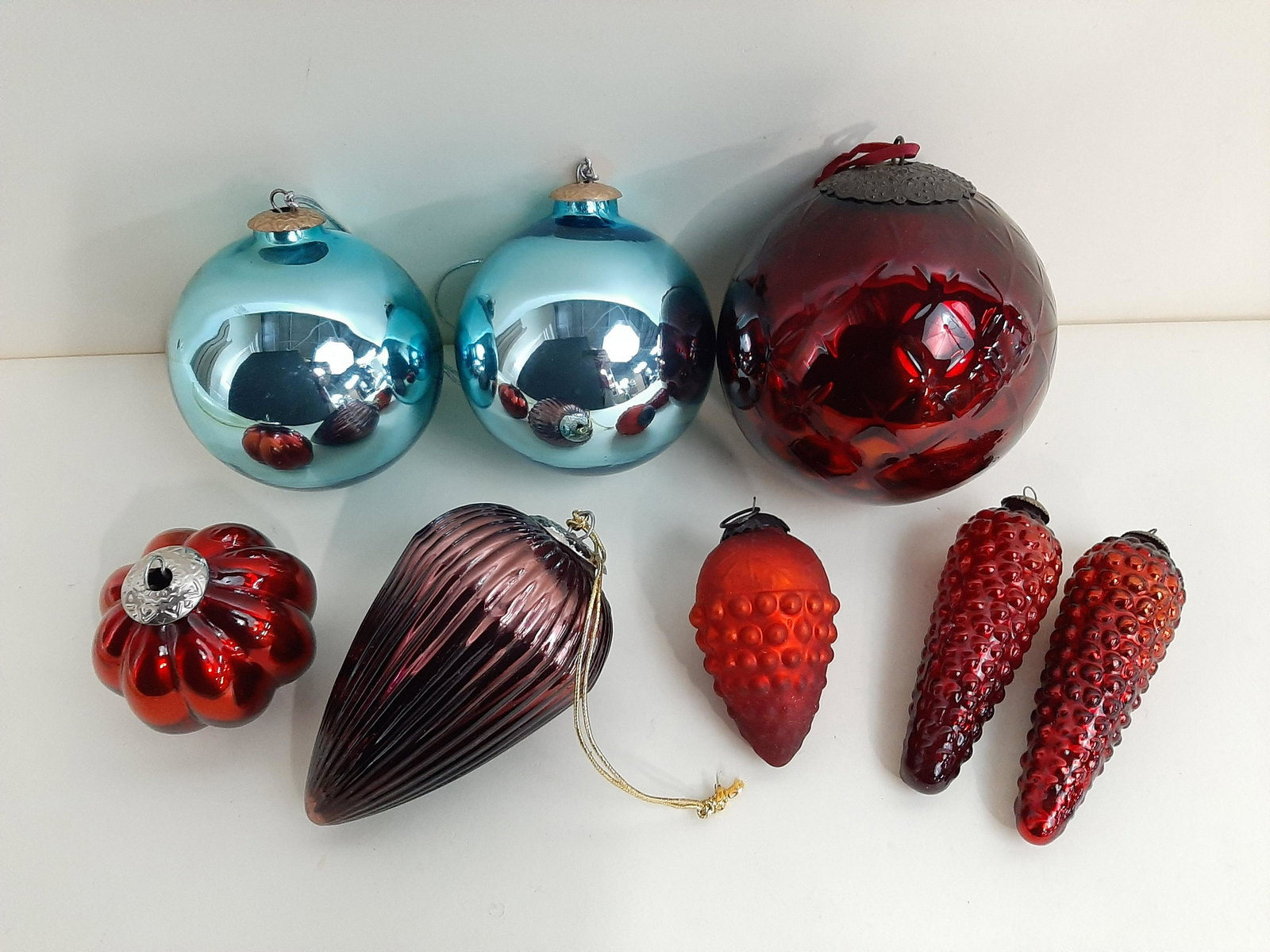 8 Vintage Glass Christmas Ornaments: 1-3/4" to 5-3/4" wide X 3-3/4" to 6-1/4" high. IMPORTANT: Before bidding, please read the terms and conditions. When you registered for the auction you agreed to these terms and will be required to co