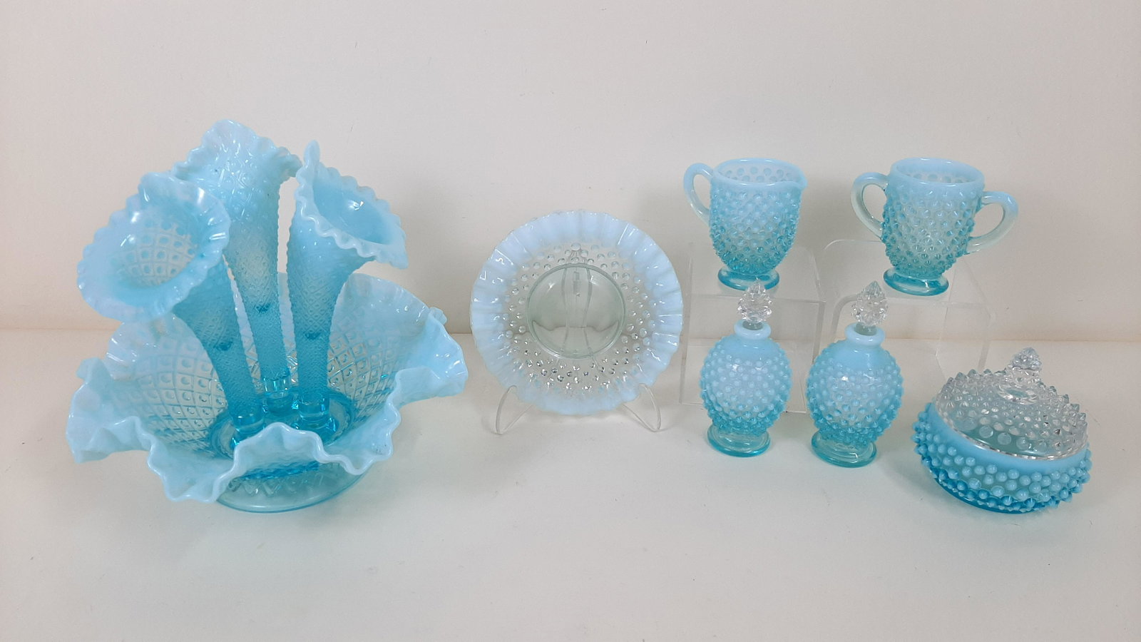 7 Pcs Opalescent Hobnail Glass incl. Epergne: 3-3/4" to 10" wide X 3-1/4" to 8-3/4" high. IMPORTANT: Before bidding, please read the terms and conditions. When you registered for the auction you agreed to these terms and will be required to compl