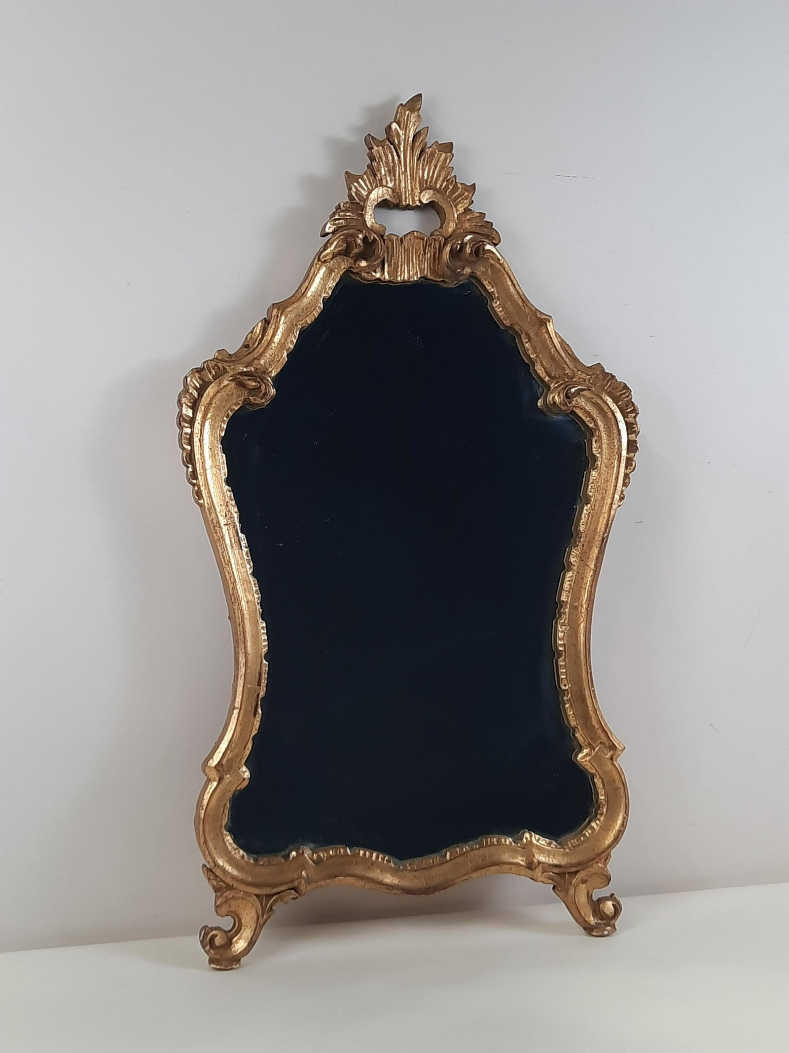 Antique Gilt Mirror: Overall with frame 29-1/2" high x 16-1/2" wide. IMPORTANT: Before bidding, please read the terms and conditions. When you registered for the auction you agreed to these terms and will be required to c