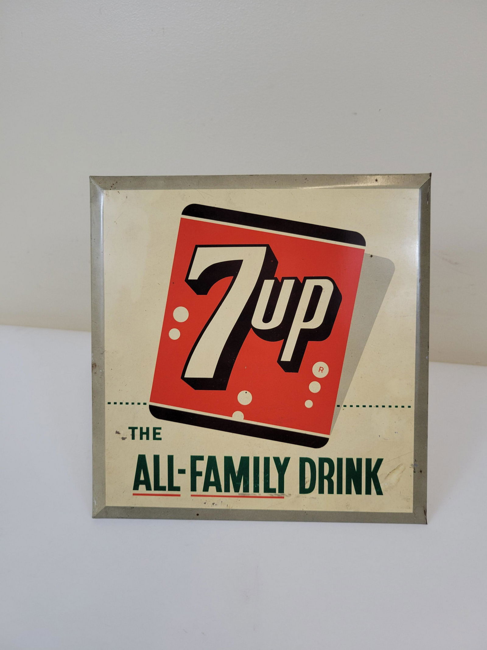 7 Up All Family Drink Sign: 9 1/4" wide X 3 1/4" deep X 8 1/2" high. Has some discoloring. IMPORTANT: Before bidding, please read the terms and conditions. When you registered for the auction you agreed to these terms and will b