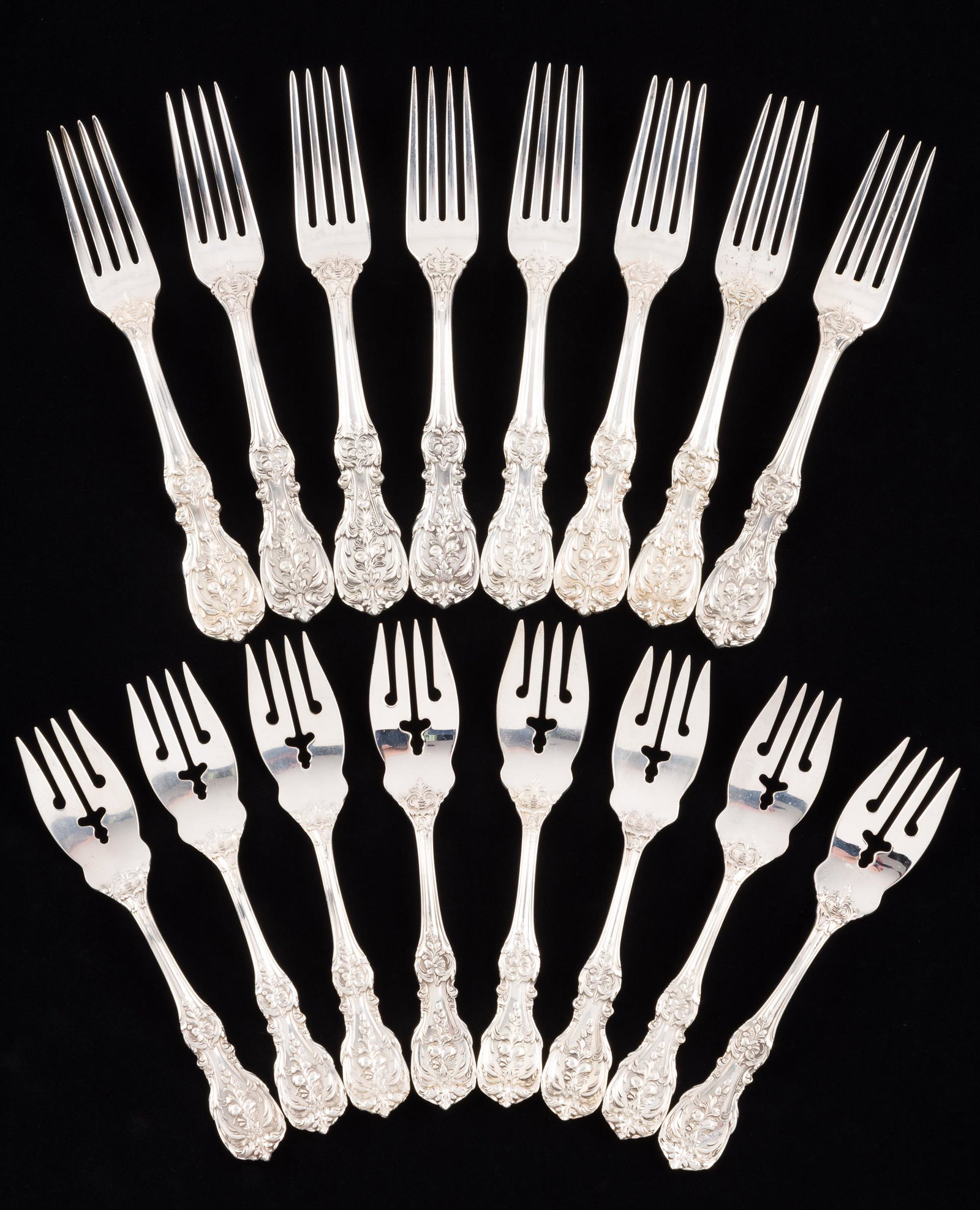 16 Reed & Barton Sterling Forks in Francis I: DESCRIPTION: Includes eight salad forks and eight luncheon forks. MEASUREMENTS: Salad forks 6", luncheon forks 7". 25.6 ozt. CONDITION: Two forks monogrammed. Very good. All pieces appear unused. IMPO