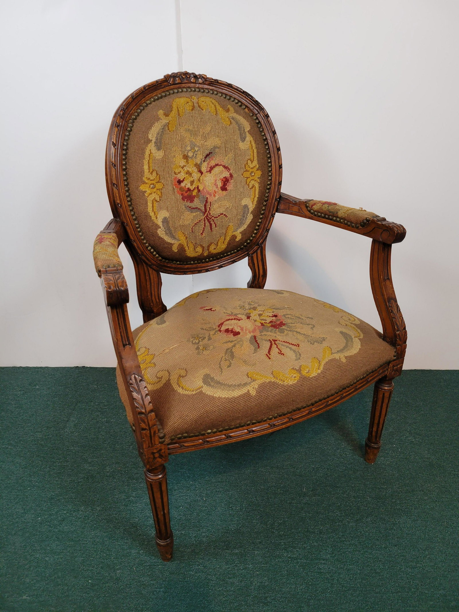Needle Point Arm Chair: 25 1/4" wide ax 21 1/2" deep X 35" high. Has rip in seat. IMPORTANT: Before bidding, please read the terms and conditions. When you registered for the auction you agreed to these terms and will be req
