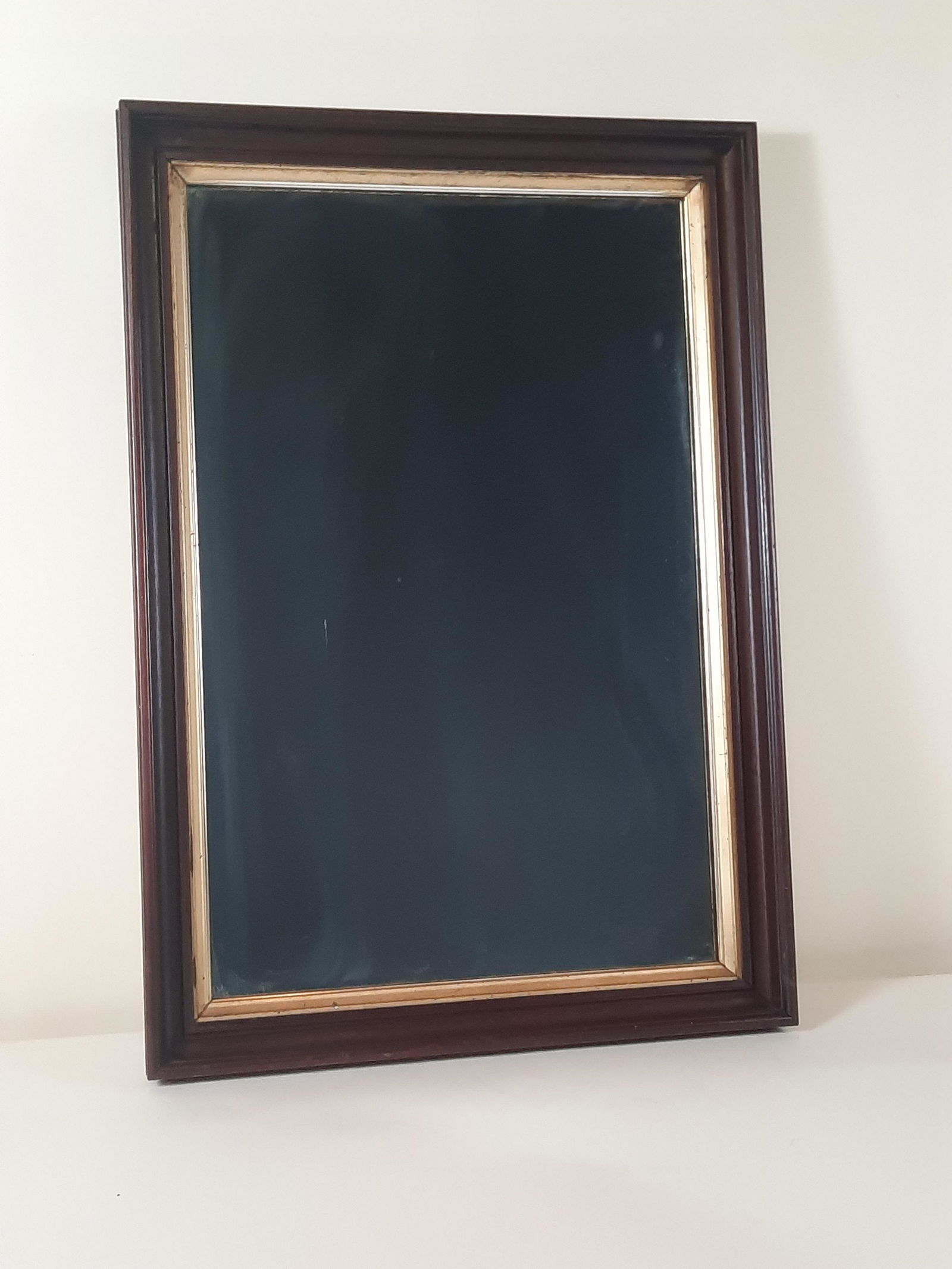 Antique Mirror: Overall with frame 29-3/4" high x 20-3/4" wide. Some spotting and streaking. IMPORTANT: Before bidding, please read the terms and conditions. When you registered for the auction you agreed to these te