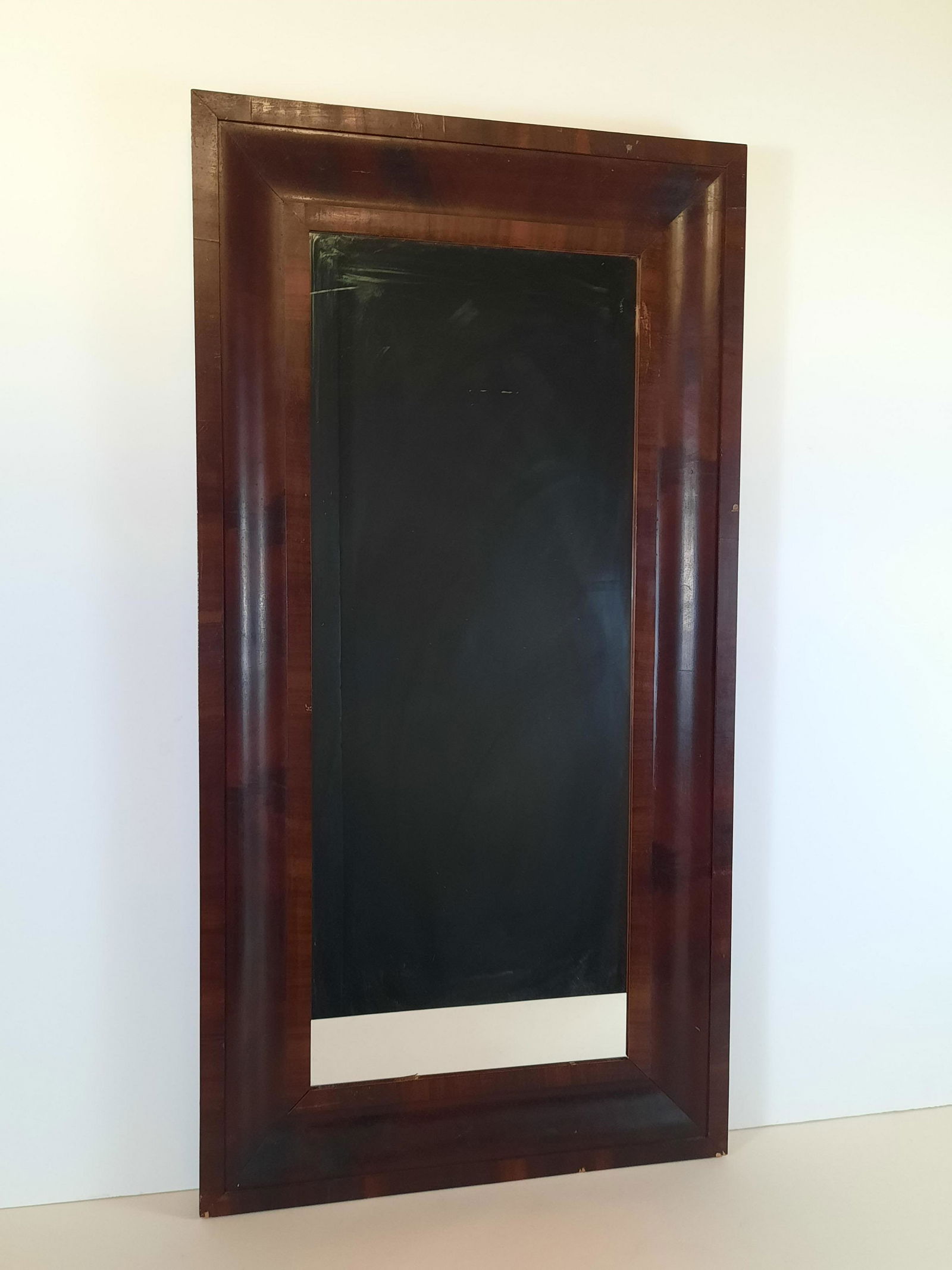 Antique Mirror: Overall with frame 45-1/2" high x 23-1/2" wide. Some wood finish losses. IMPORTANT: Before bidding, please read the terms and conditions. When you registered for the auction you agreed to these terms