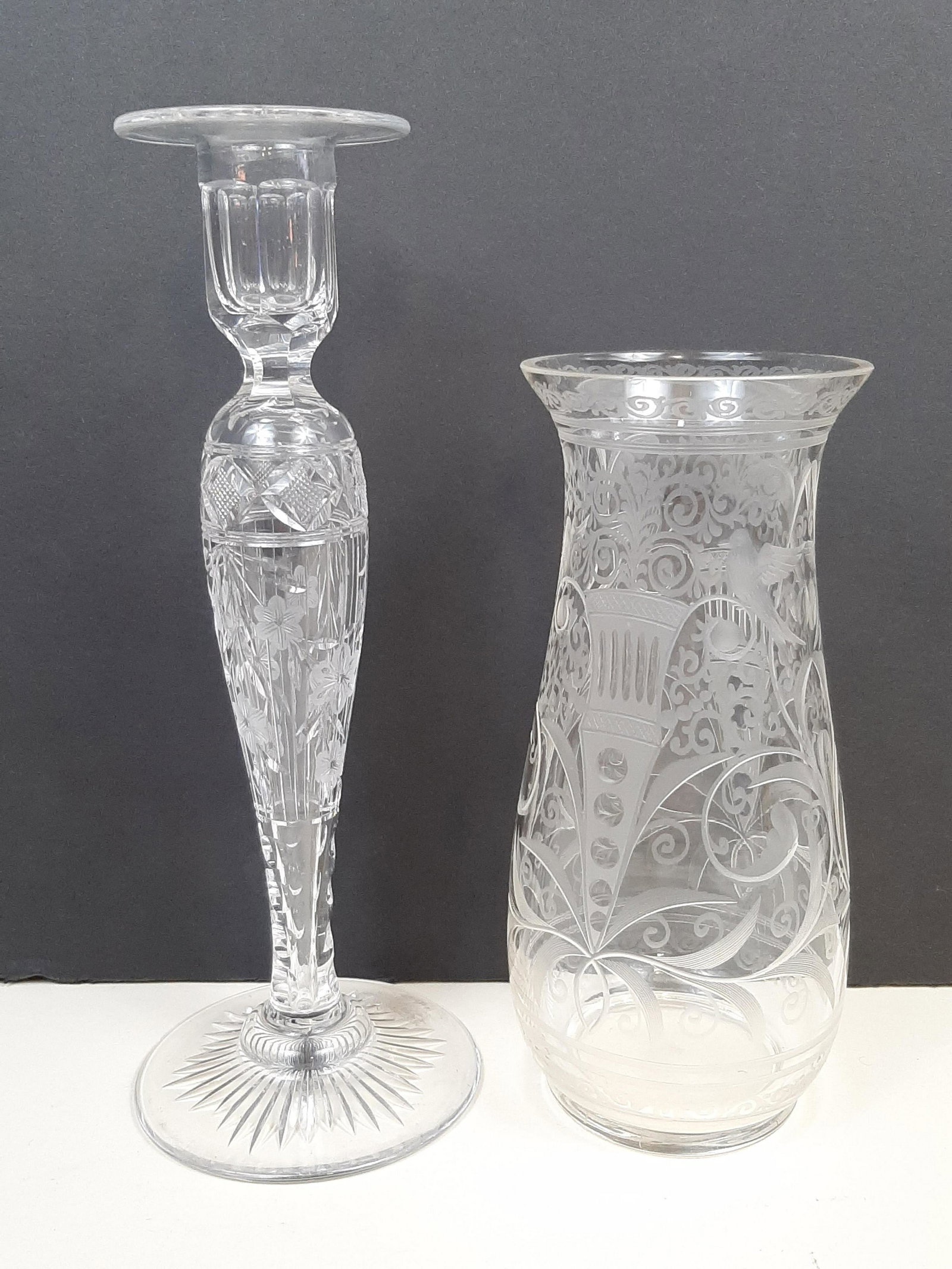 Etched Glass Vase and Candlestick: 3-1/2" to 4" diameter X 8-1/4" to 10" high. Vase has chip. IMPORTANT: Before bidding, please read the terms and conditions. When you registered for the auction you agreed to these terms and will be re