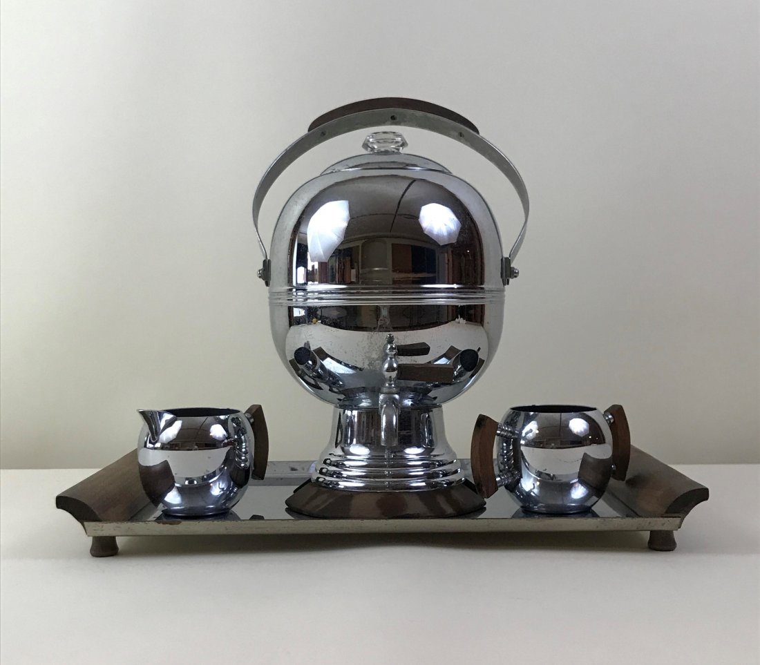 Keystonewear Coffee Set: Keystonewear coffee urn with creamer, sugar bowl, and tray. Chrome plated. Numbered 128 on bottom. Plug not included. Urn: 14" High x 8" Wide. Cream and Sugar: 2-1/5" High. Tray: 16-1/2? Wide x 9-3/4"