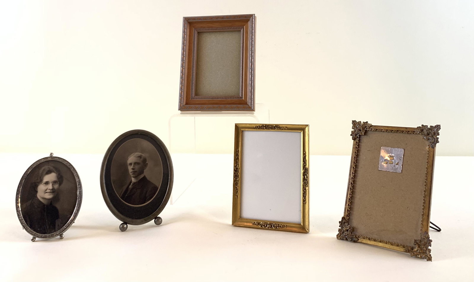 5 Table Frames: Wooden frame overall size 5 1/4" wide x 6 3/4" high. Gold Colored Filagree Frame overall size 4 1/2 " wide x 6" high. Antique Bronze Colored Frame overall size 4 1/4" wide x 6 1/4" high. Oval Frame ov