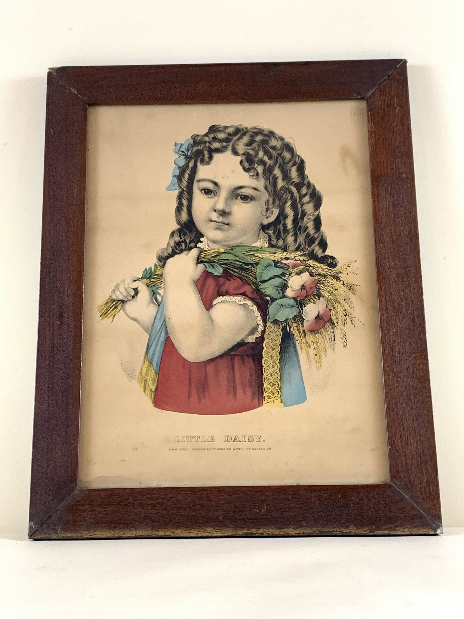 Currier & Ives “Little Daisy" Print: Areas of foxing. Minor area of water damage to bottom left corner. Top of frame loose. IMPORTANT: Before bidding, please read the terms and conditions. When you registered for the auction you agreed t