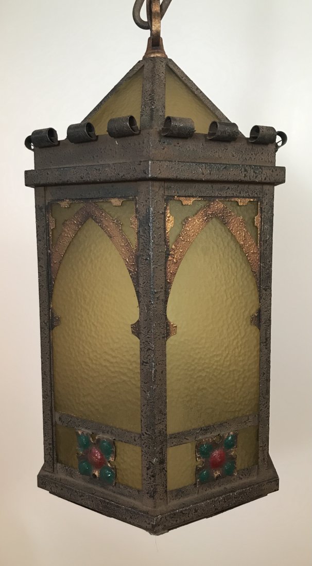 Cast Metal and Glass Hanging Light: Adjustable chain. Shade 21” high x 10” wide. IMPORTANT: Before bidding, please read the terms and conditions. When you registered for the auction you agreed to these terms and will be required to 