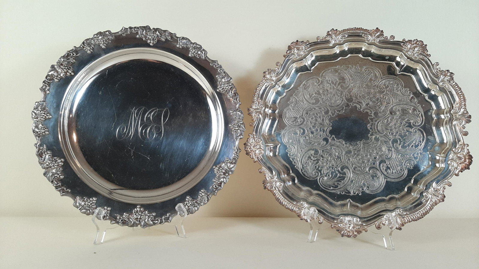 2 Silverplate Chargers: 14-1/4" to 15-1/4" diameter. IMPORTANT: Before bidding, please read the terms and conditions. When you registered for the auction you agreed to these terms and will be required to comply with them.