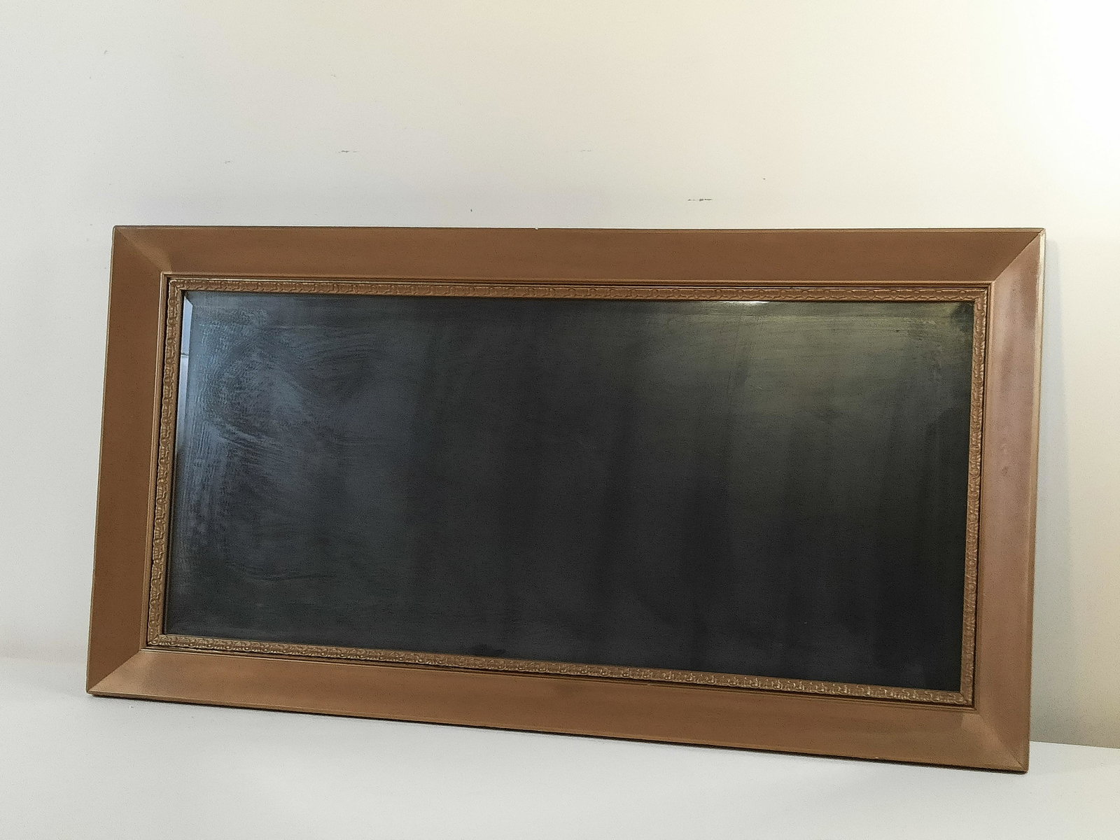 Antique Gilt Mirror: Overall with frame 23-1/2" high x 45-1/2" wide. Some streaking and spotting to glass. IMPORTANT: Before bidding, please read the terms and conditions. When you registered for the auction you agreed to