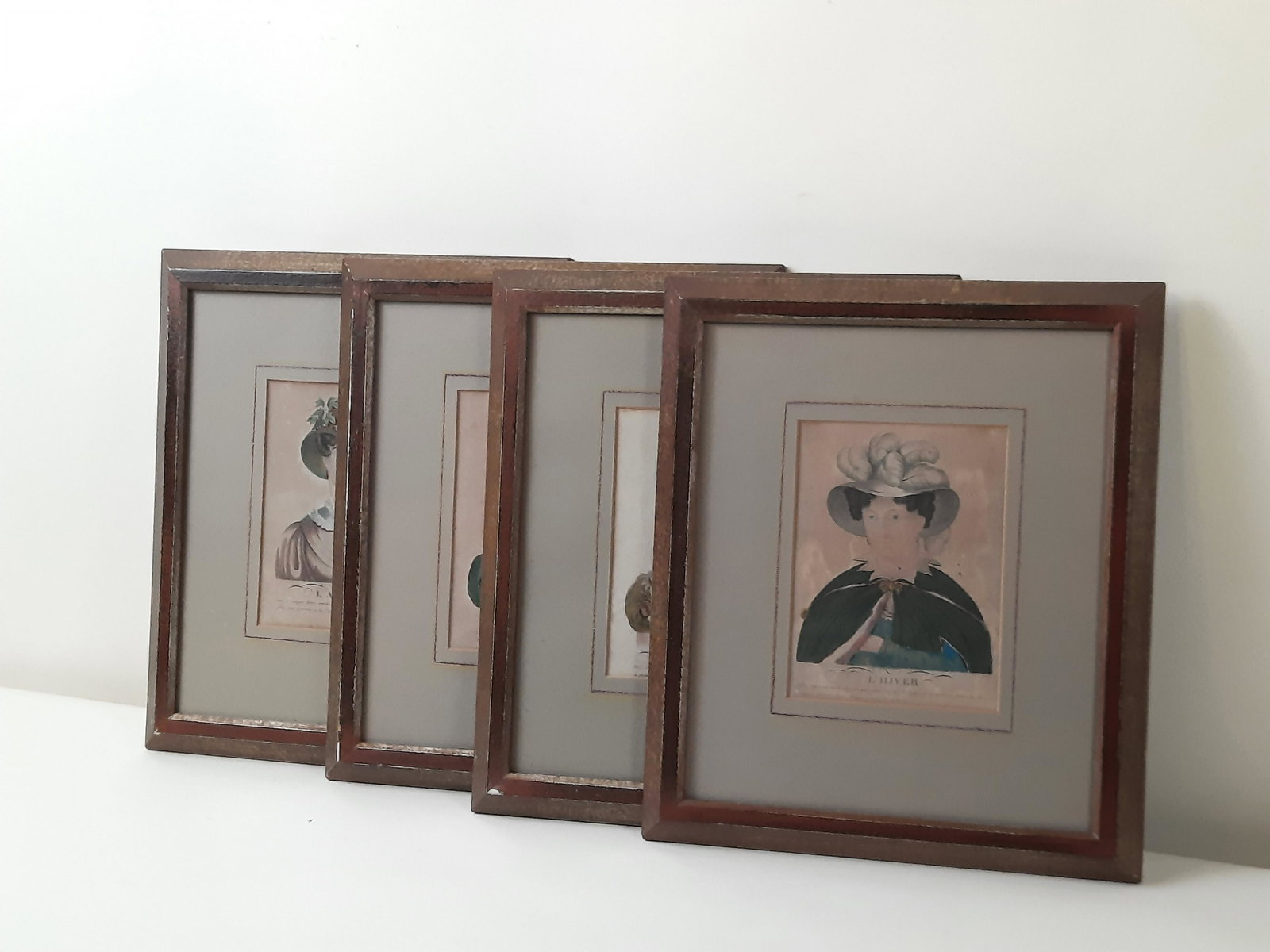 4 Seasons in French Prints incl Le Printems: Also includes L' Hiver, L'eté and L' Automne. Each overall with frame 14-1/2" high x 12-1/2" wide. IMPORTANT: Before bidding, please read the terms and conditions. When you registered for the auction