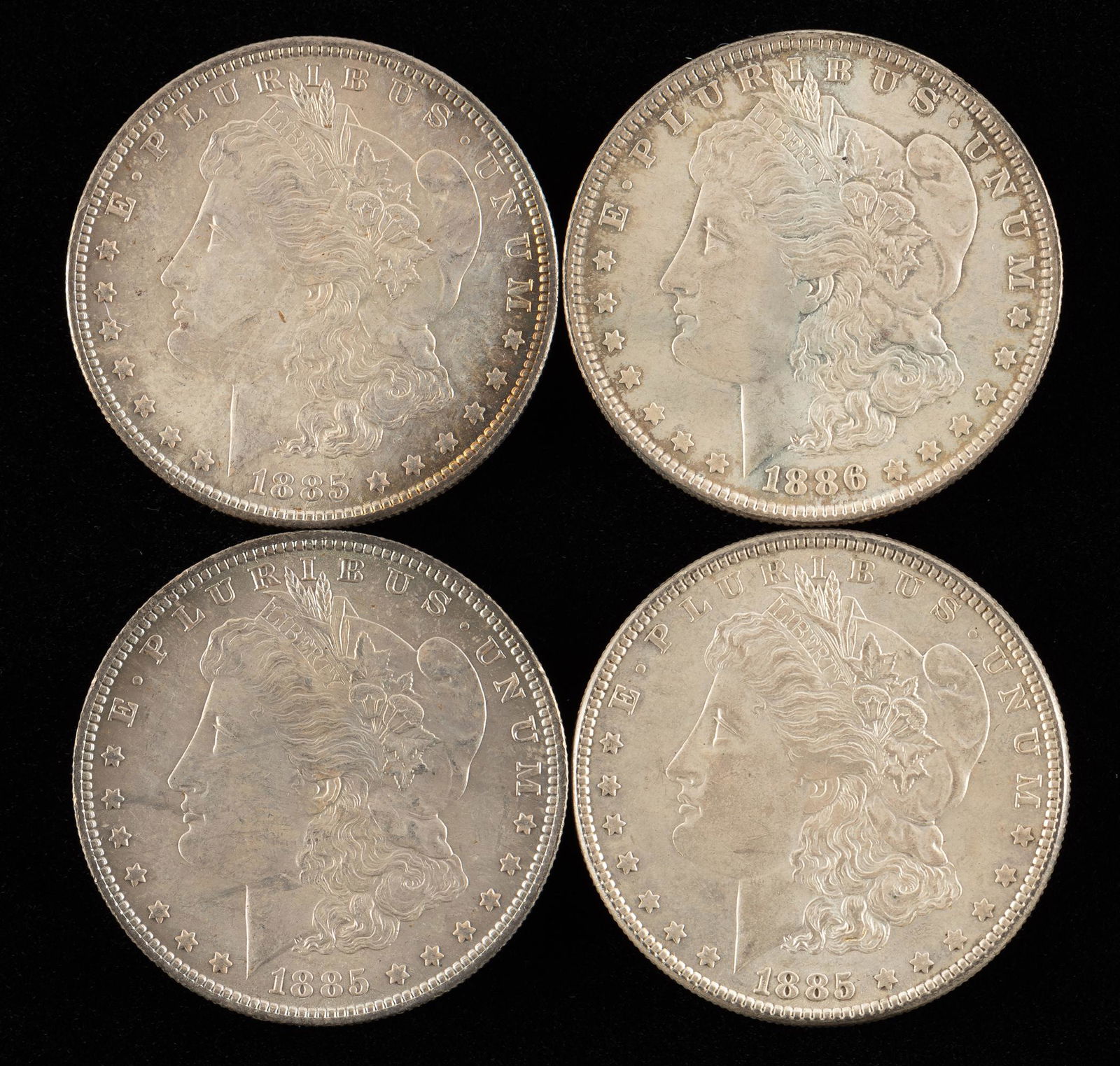 4 Morgan Silver Dollars Incl 1886 (1 of 2)