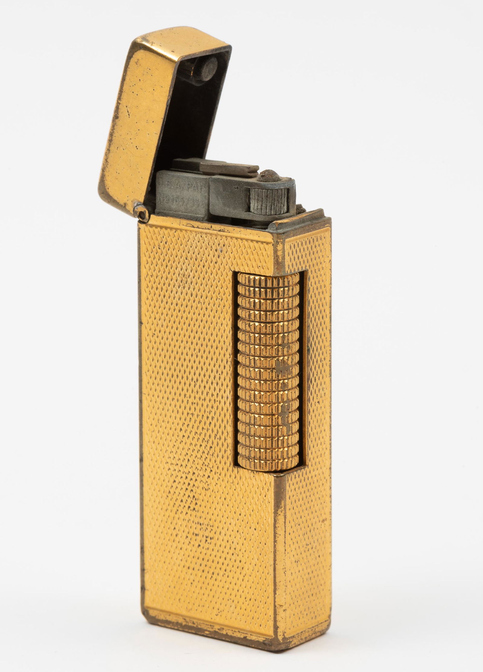 Dunhill Lighter: Monogrammed. 2-1/2" high x 1" wide. IMPORTANT: Before bidding, please read the terms and conditions. When you registered for the auction you agreed to these terms and will be required to comply with t