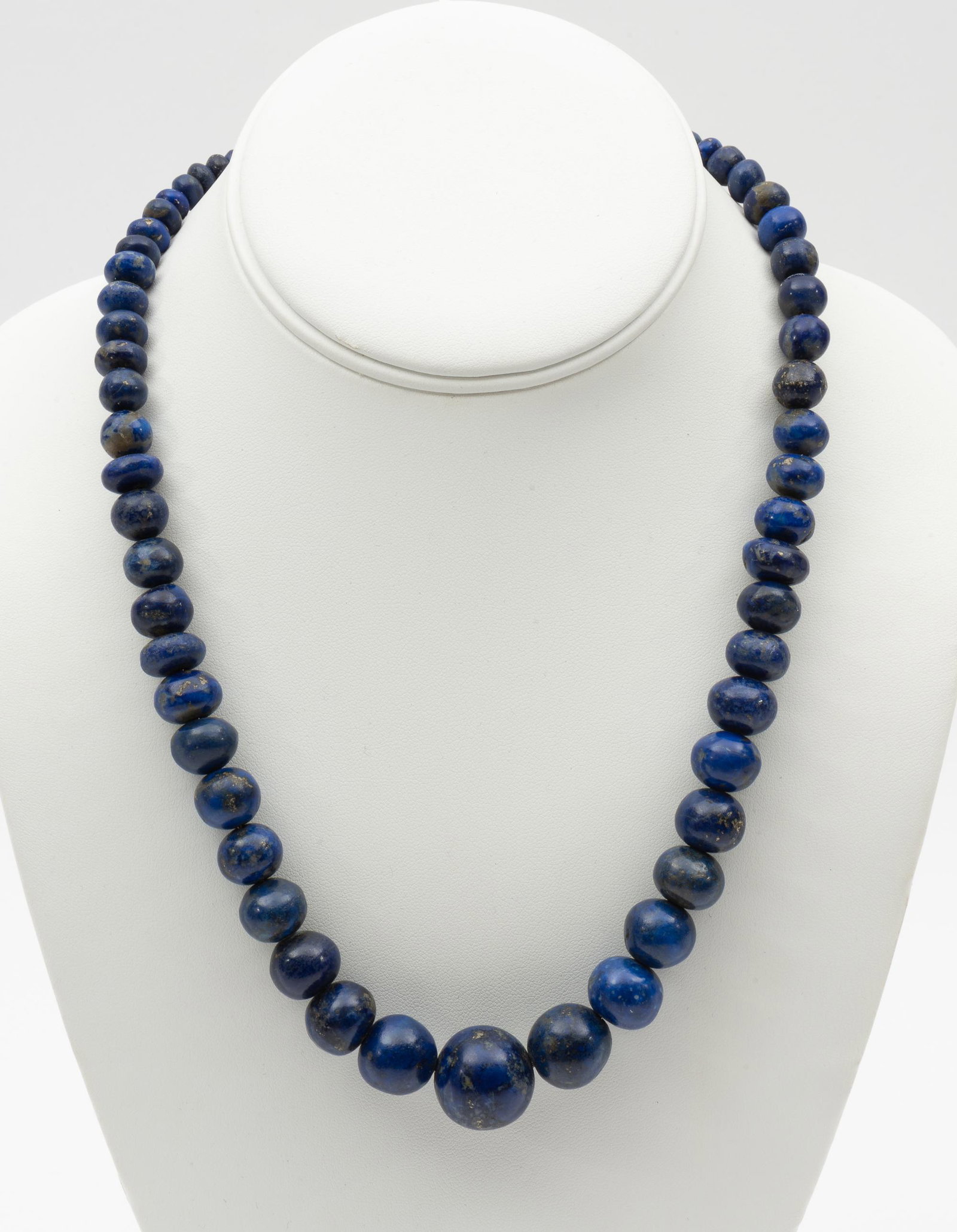 Lapis Lazuli Bead Necklace: 19" long. Beads 6 mm to 18 mm. IMPORTANT: Before bidding, please read the terms and conditions. When you registered for the auction you agreed to these terms and will be required to comply with them.