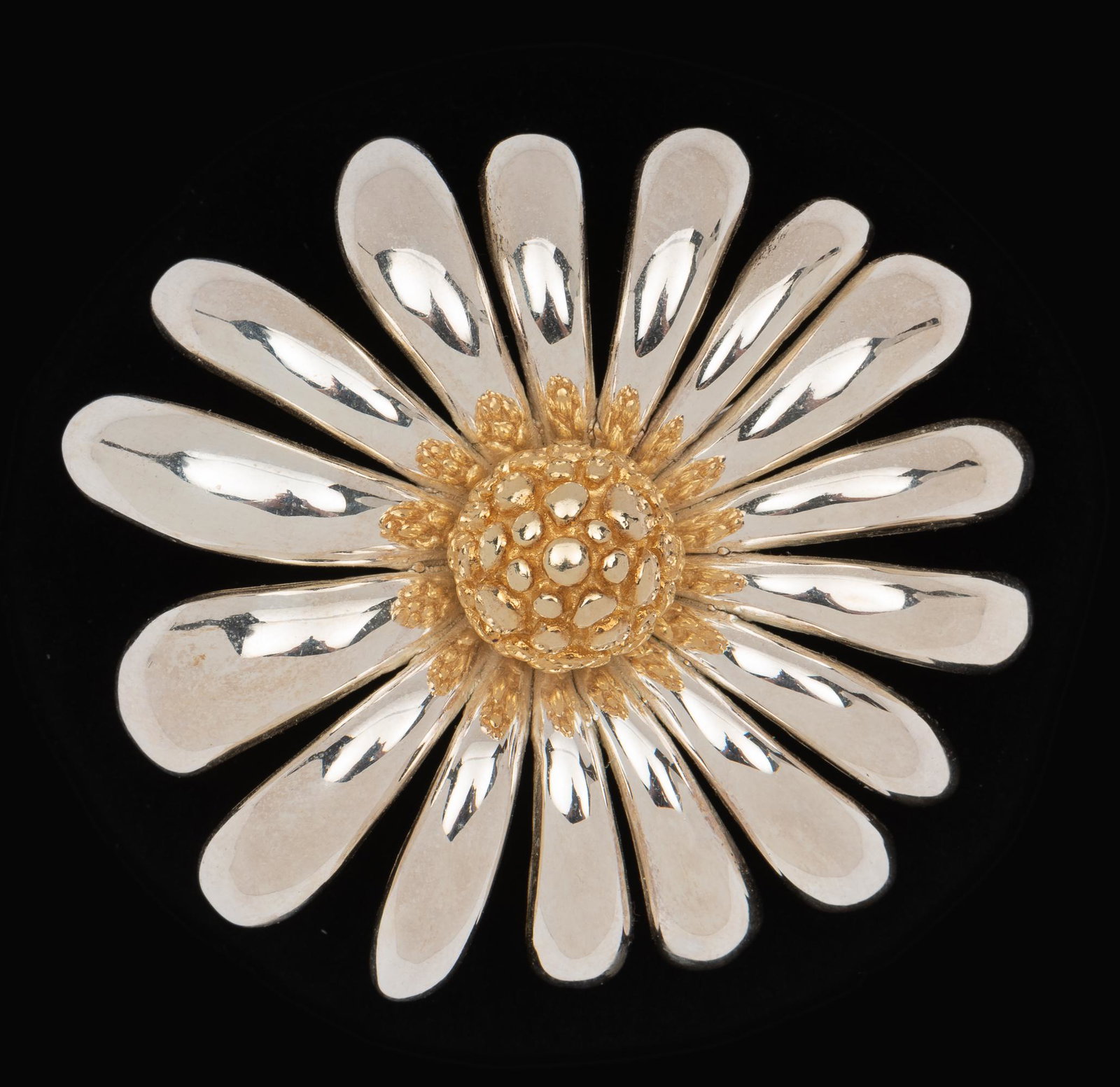Two-Tone Sterling Daisy Pin: 2-3/8" diameter. IMPORTANT: Before bidding, please read the terms and conditions. When you registered for the auction you agreed to these terms and will be required to comply with them.