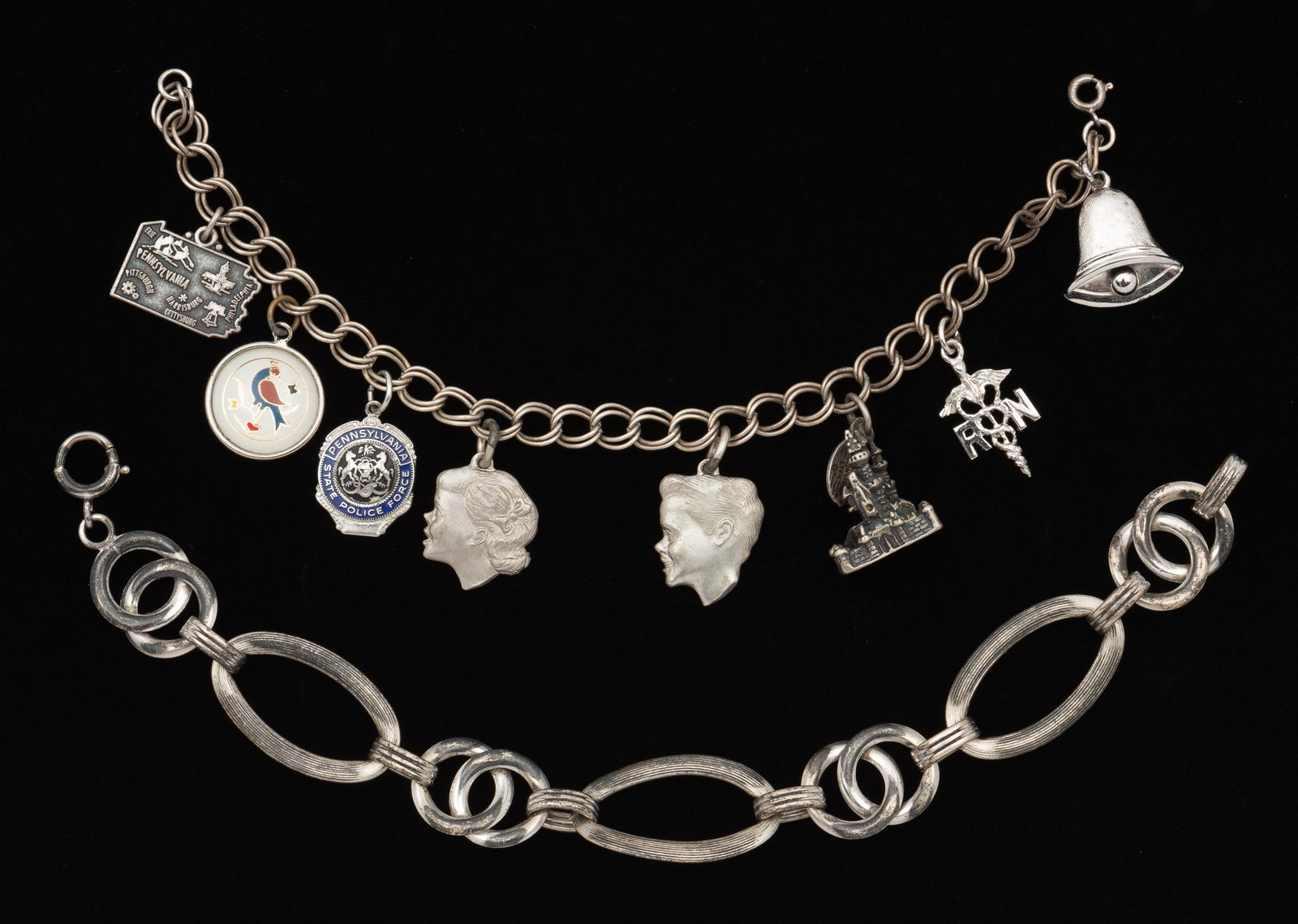 2 Sterling Bracelets: Charm bracelet 7" long. Link bracelet 7-3/4" long. IMPORTANT: Before bidding, please read the terms and conditions. When you registered for the auction you agreed to these terms and will be required t