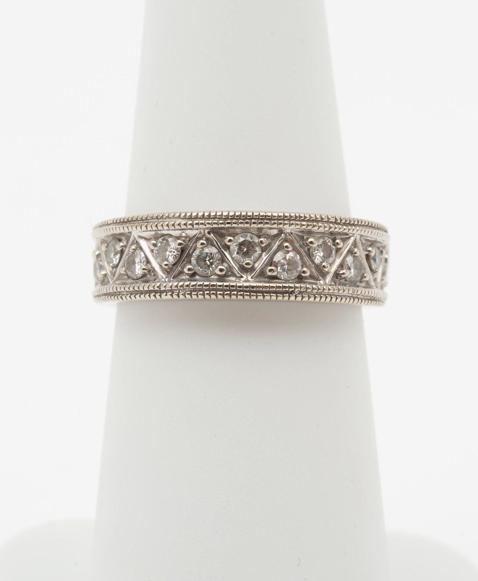14K .33 CTW Diamond Band: Eleven three point diamonds. Clarity SI2, Color H-I. 3.4 dwt (5.3 gr). Size 6. IMPORTANT: Before bidding, please read the terms and conditions. When you registered for the auction you agreed to these 