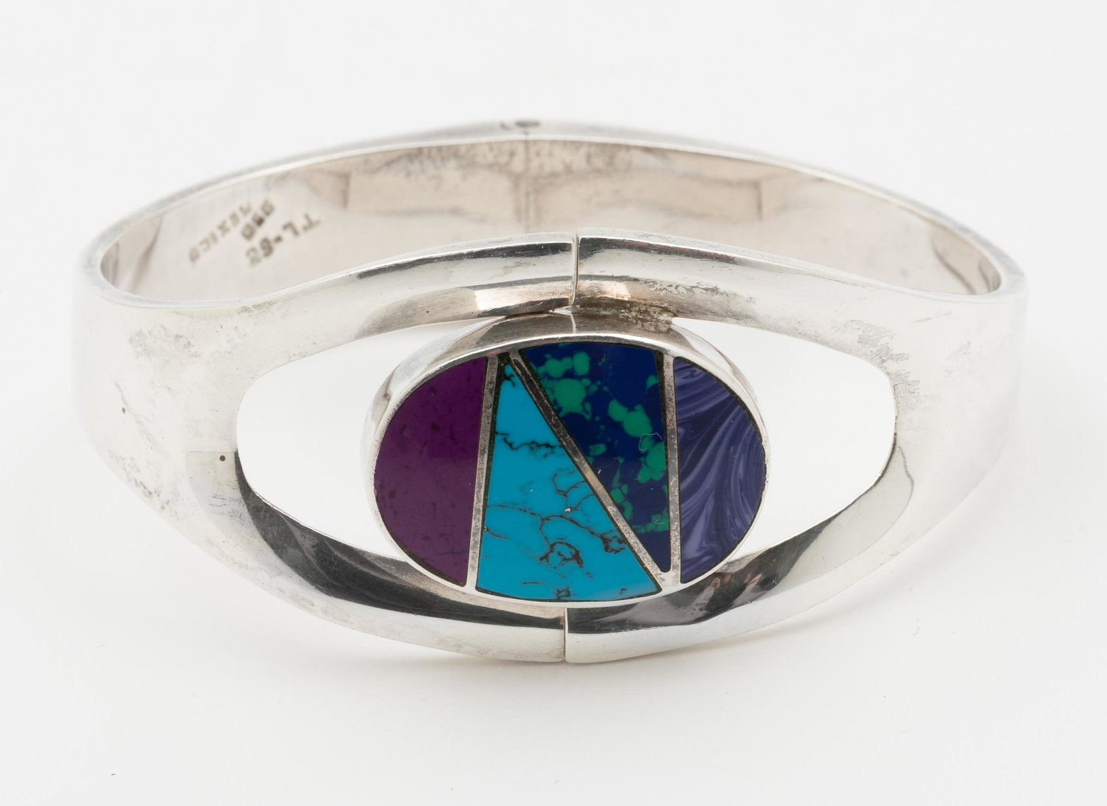Taxco Sterling Inlaid Bracelet: Hinged. 2-1/2" interior diameter x 1-1/4" at widest point. IMPORTANT: Before bidding, please read the terms and conditions. When you registered for the auction you agreed to these terms and will be re