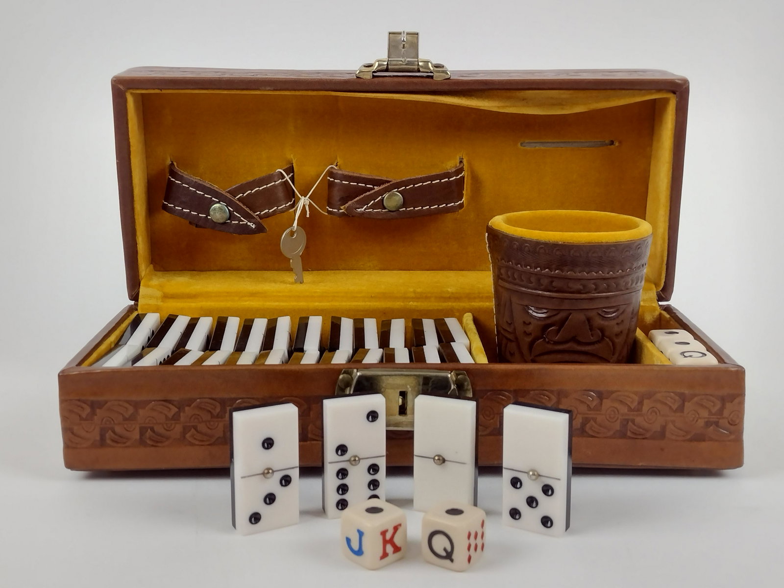 Tooled Leather Game Box: Marked Mexico. 3-5/8" x 10-3/4" wide. IMPORTANT: Before bidding, please read the terms and conditions. When you registered for the auction you agreed to these terms and will be required to comply with