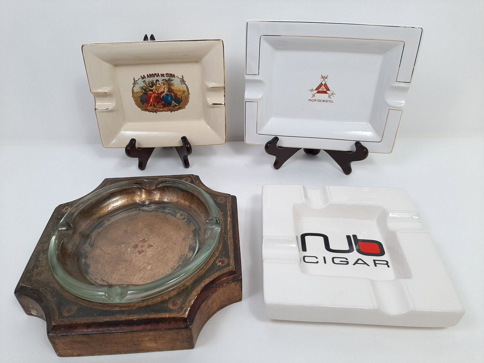 4 Cigar Ashtrays: 8" to 10" wide X 6-1/2" to 10" deep. IMPORTANT: Before bidding, please read the terms and conditions. When you registered for the auction you agreed to these terms and will be required to comply with 