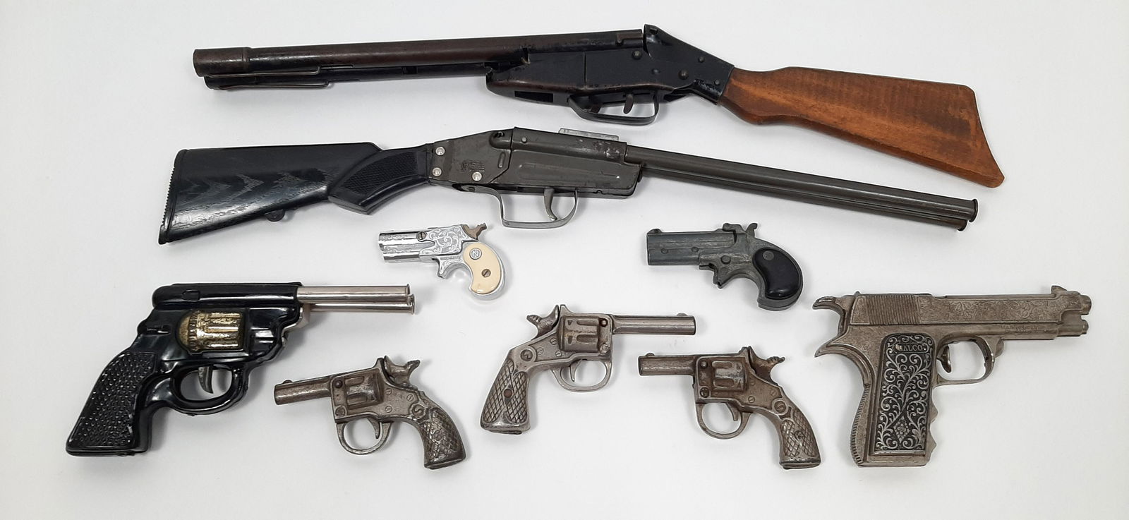 9 Toy Guns incl. Nichols Dyna-Mite: Also includes Zee Toys Derringer and Halco military pistol. 3-1/4" to 21-1/2" long. IMPORTANT: Before bidding, please read the terms and conditions. When you registered for the auction you agreed to t