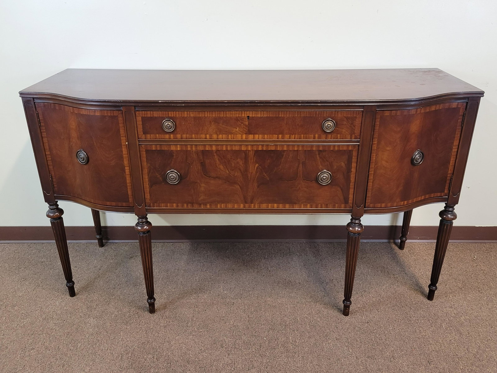 Flame Mahogany with Banded Inlay Sideboard: 66" wide X 22" deep X 37" high. IMPORTANT: Before bidding, please read the terms and conditions. When you registered for the auction you agreed to these terms and will be required to comply with them.