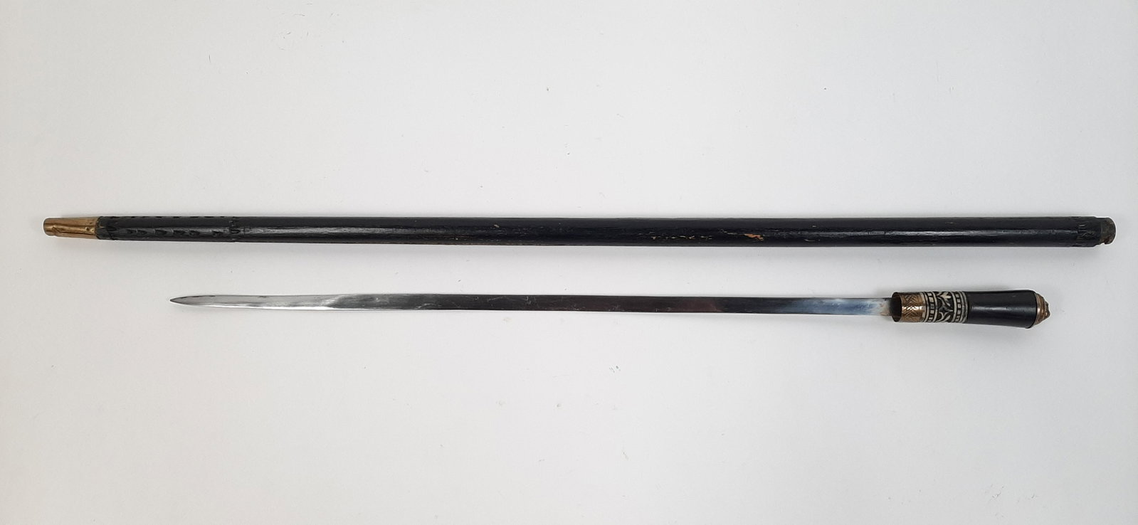 Antique Indian Sword Cane with Bone Inlay: 36" long. IMPORTANT: Before bidding, please read the terms and conditions. When you registered for the auction you agreed to these terms and will be required to comply with them.